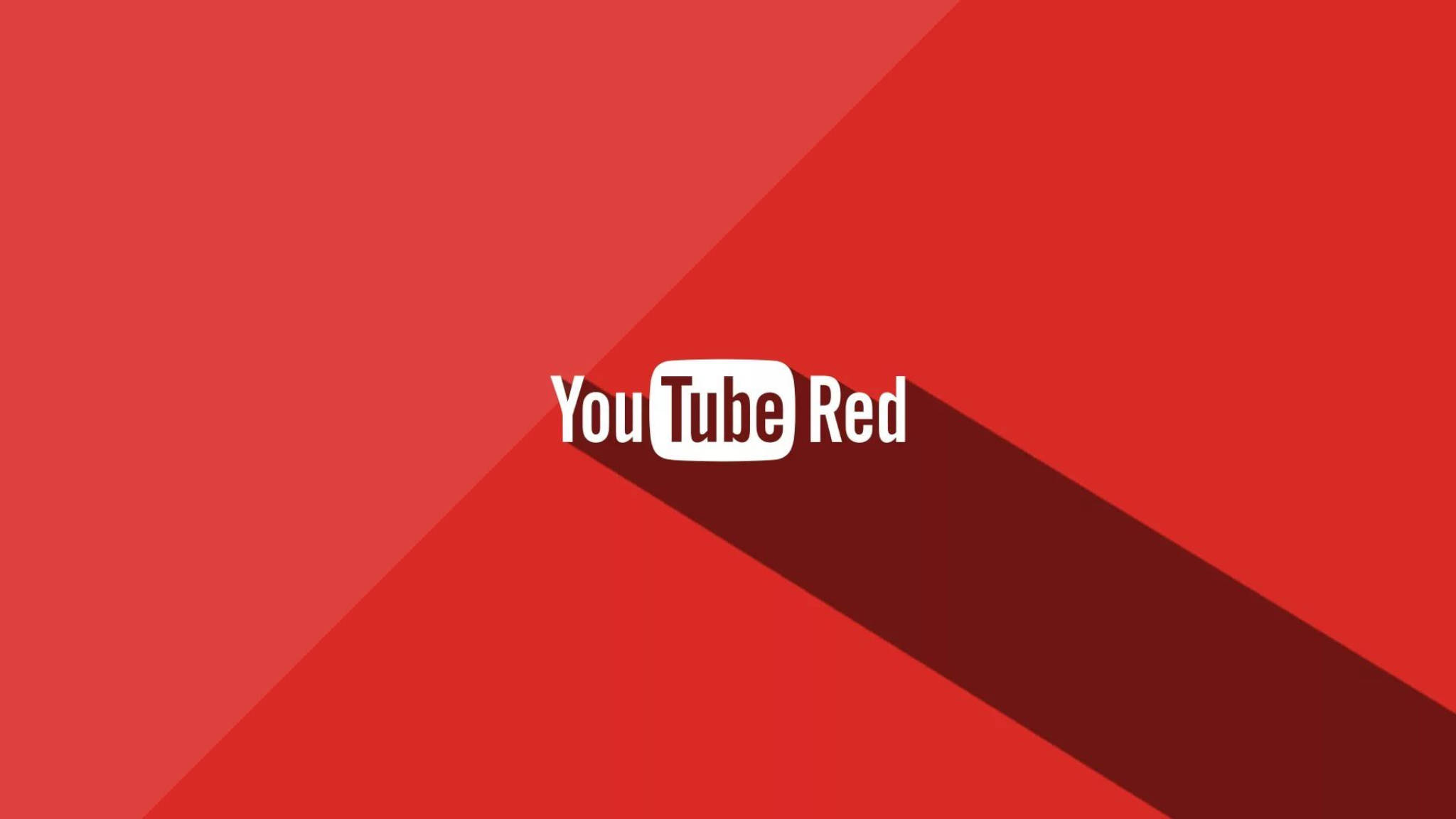 Internet 桌布 壁紙 — YouTube Red 標誌居中於帶有對角線陰影的鮮明紅色幾何背景上。