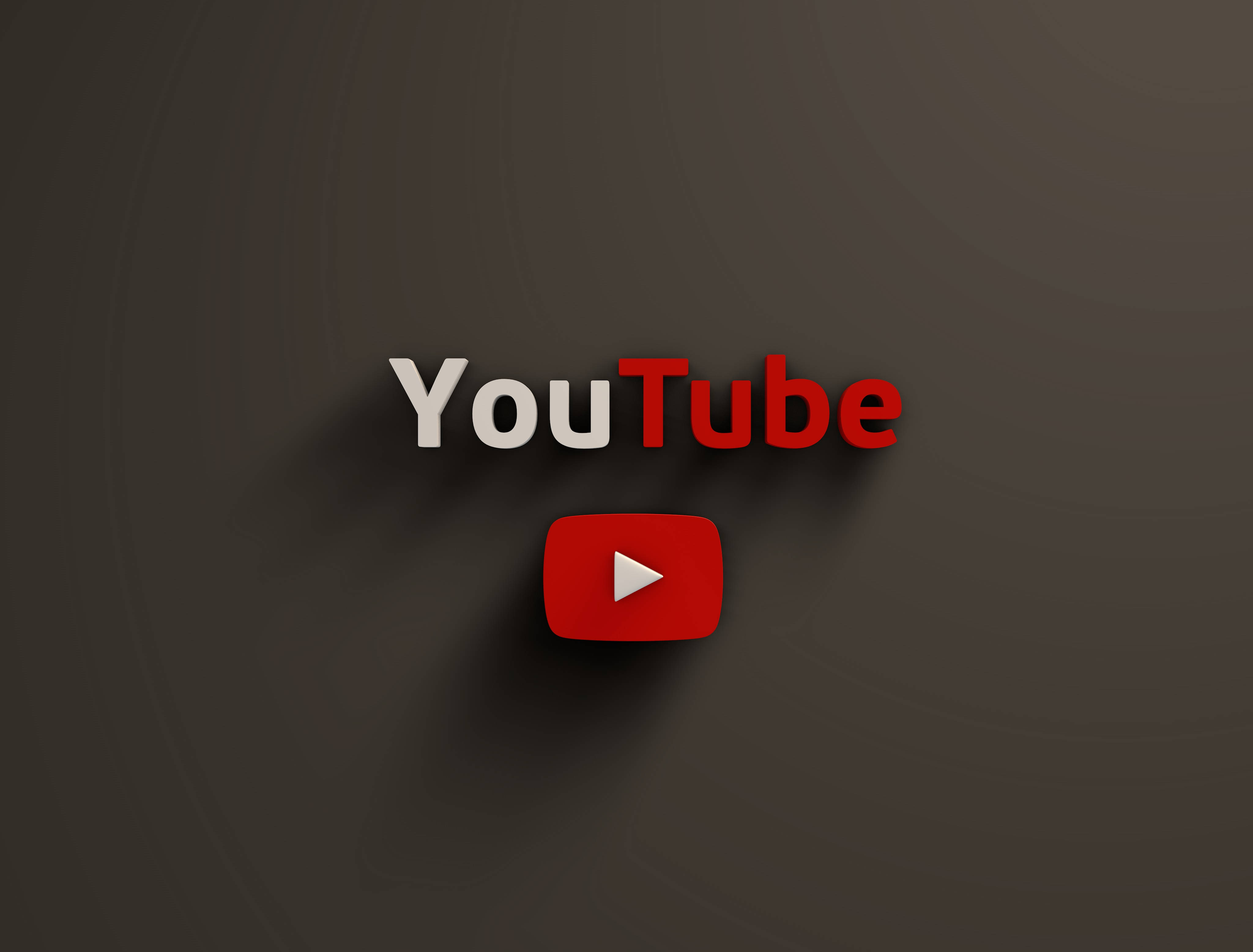 YouTube Logo 桌布 壁紙 — YouTube 標誌，紅色播放按鈕居中，位於深灰色漸變背景上，帶有柔和陰影。