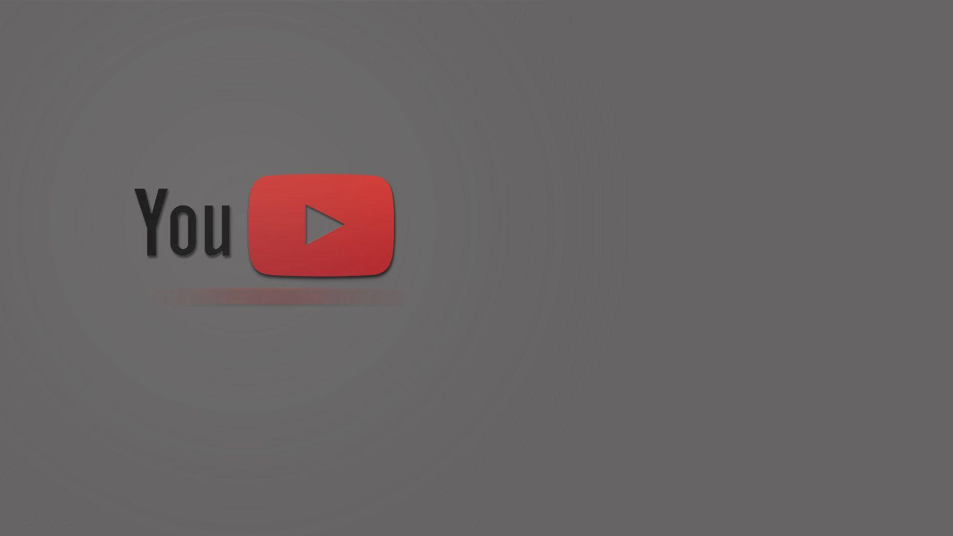 美學 桌布 壁紙 — YouTube 標誌居中於深灰色漸變背景上，帶有微妙的圓形光效。