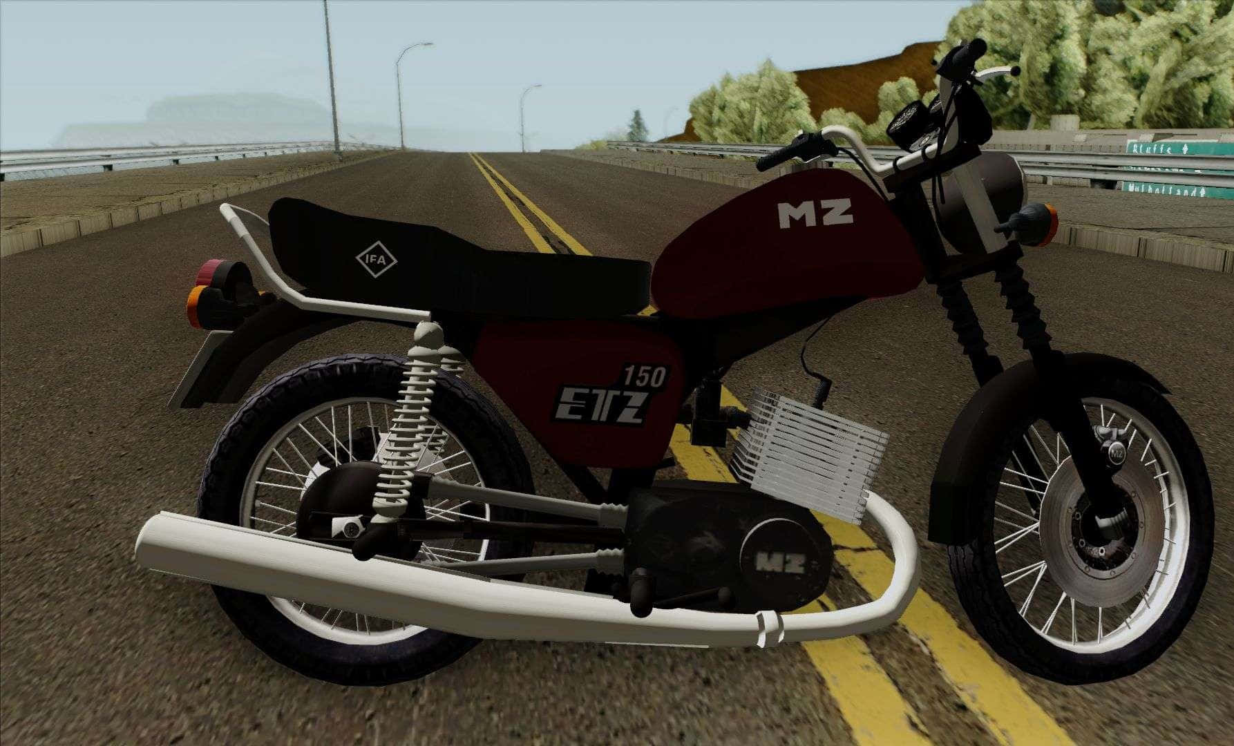 Mz Motorcycle 桌布 壁紙 — 一架棗紅色和白色的MZ 150機車停在高速公路上，背景有黃色線條和綠色山丘。