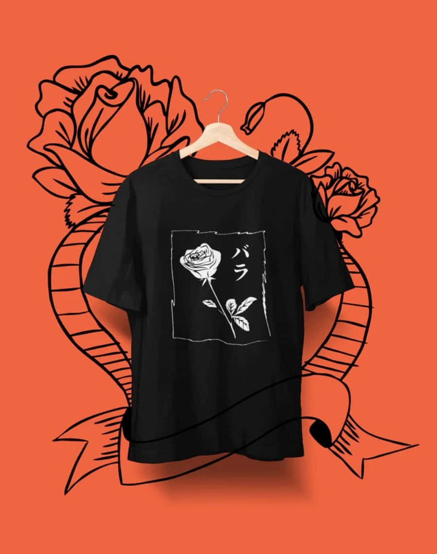 T Shirt 桌布 壁紙 — 一件帶有白色玫瑰圖案的黑色T恤掛在木衣架上，背景是鮮豔的橙色，飾有粗線條藝術玫瑰和絲帶。
