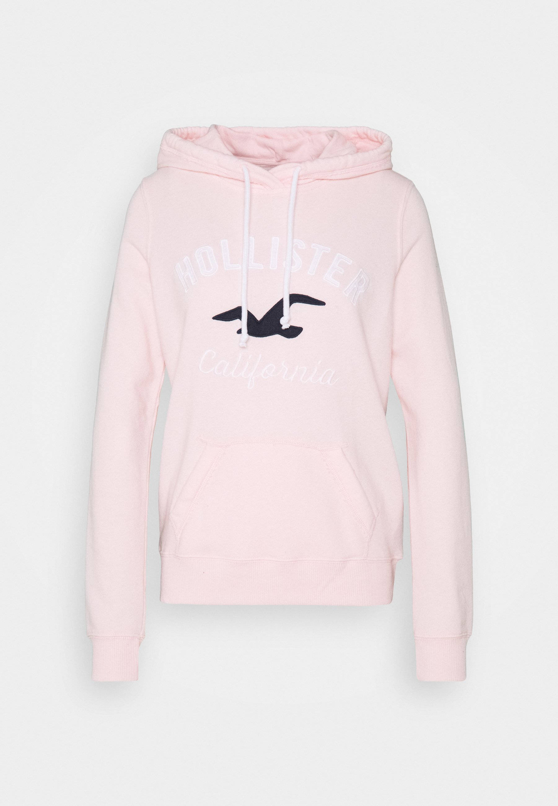 Hollister 桌布 壁紙 — 一件柔軟的粉紅色Hollister連帽衫，帶有白色抽繩和黑色海鷗標誌，背景為純白色。