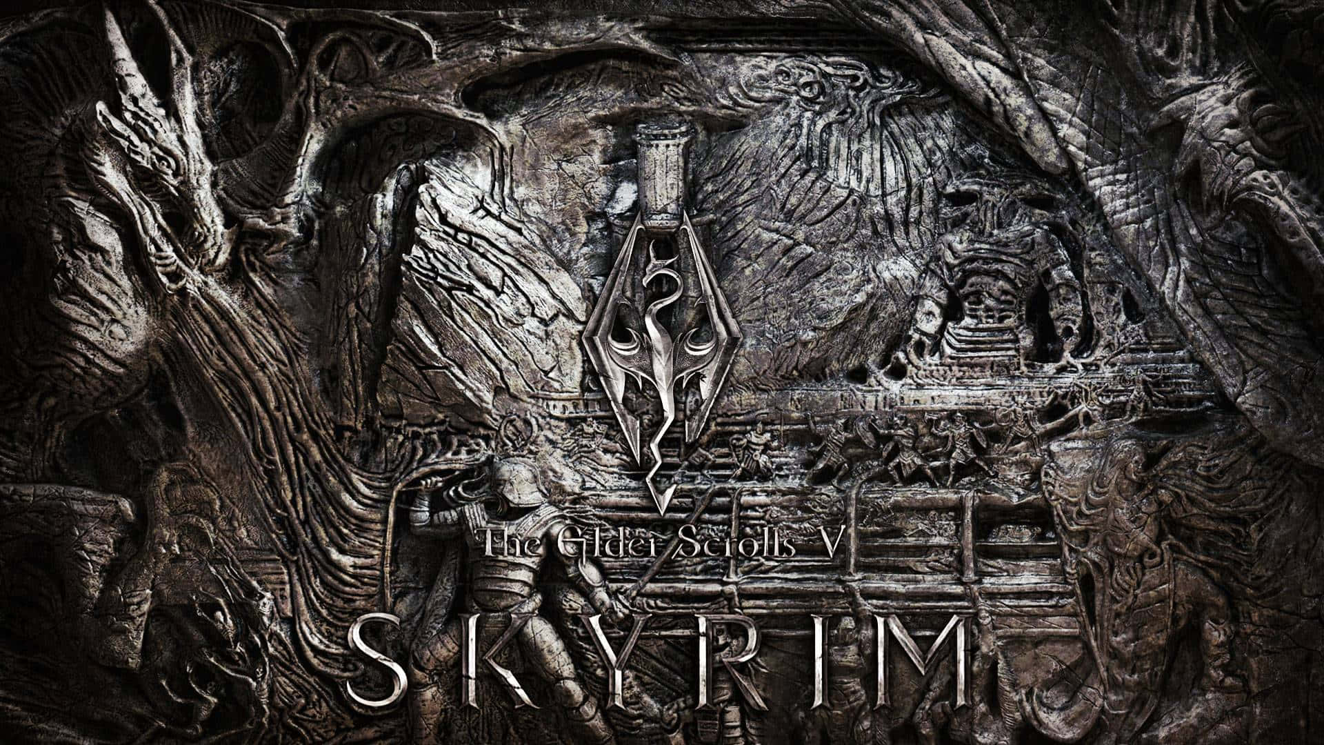 上古卷軸V：無界天際 桌布 壁紙 — 一件深色金屬浮雕藝術品，以Skyrim標誌為中心，周圍環繞著複雜的龍和北歐圖案。