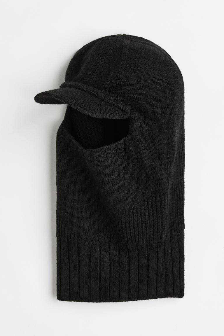 Black Ski Mask 桌布 壁紙 — 一件黑色針織巴拉克拉法帽，帶有帽檐，展示在純白色背景上。