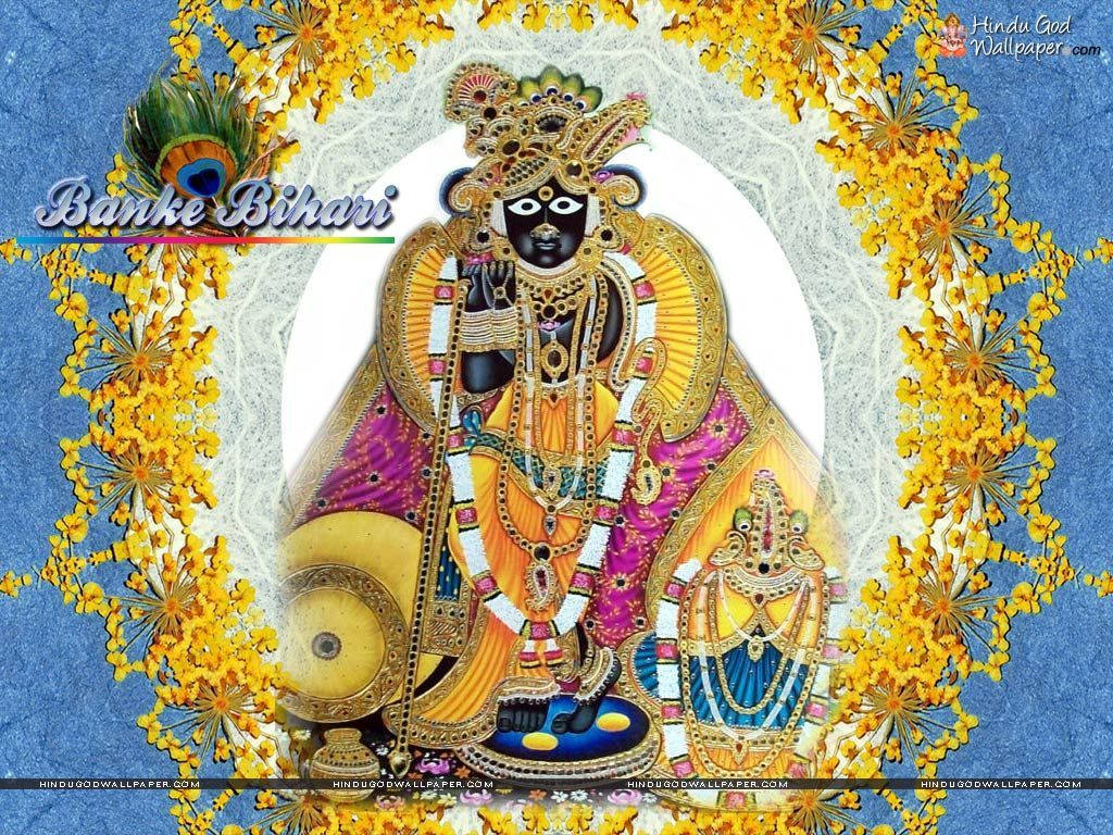 藝術 桌布 壁紙 — 一位光彩照人的印度教神祇Banke Bihari，佩戴金色珠寶和色彩繽紛的服飾，以鮮豔的黃色花朵襯托在藍色紋理背景上。