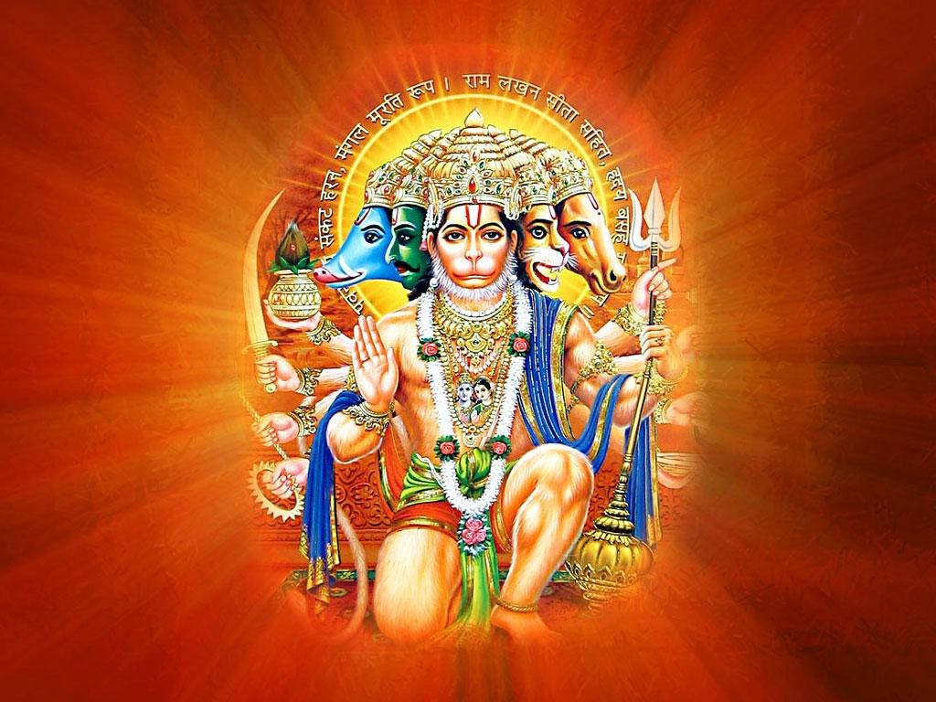 hanuman 4K HD 桌布 壁紙 — 一位光芒四射的印度教神祇，有多隻手臂和多個頭顱，佩戴珠寶，坐在發光的橙色背景前。