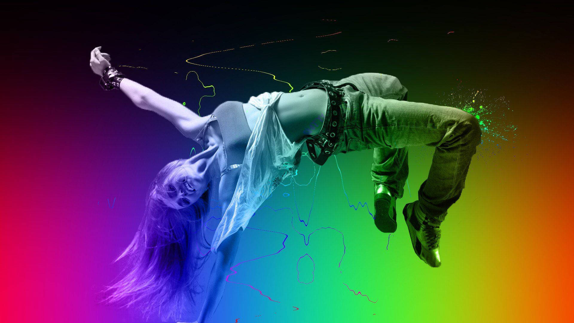 dancer 桌布 壁紙 — 一位動感舞者於半空中，背景為鮮豔彩虹漸變色及發光霓虹條紋。