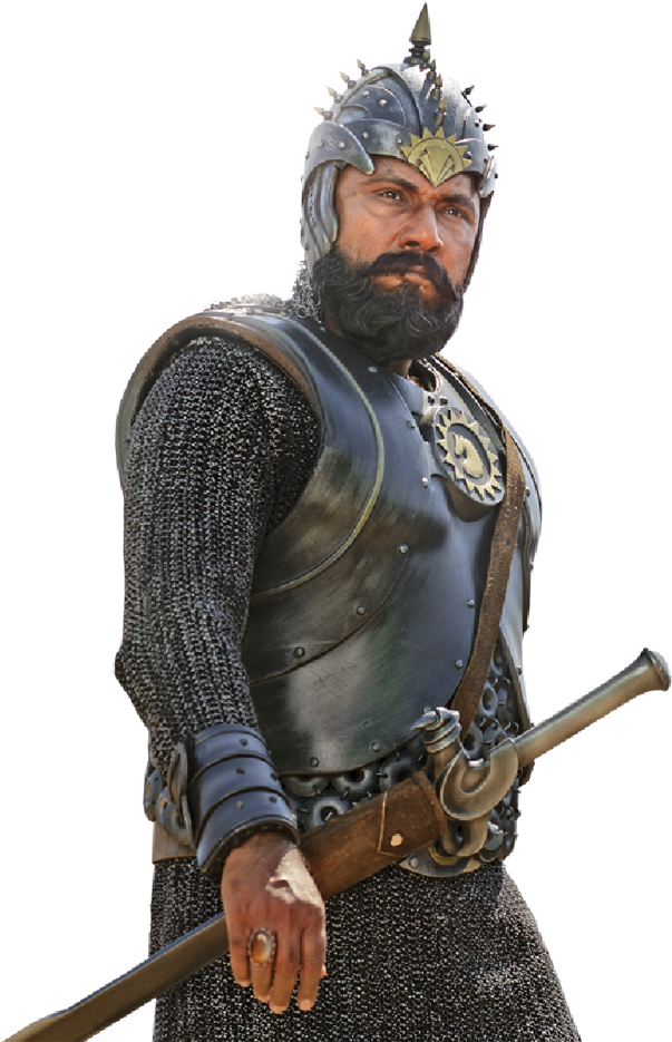 Baahubali 桌布 壁紙 — 一位嚴肅的鬍鬚騎士身穿精細的鎖子甲和金屬盔甲，在黑色背景前手持一把劍。