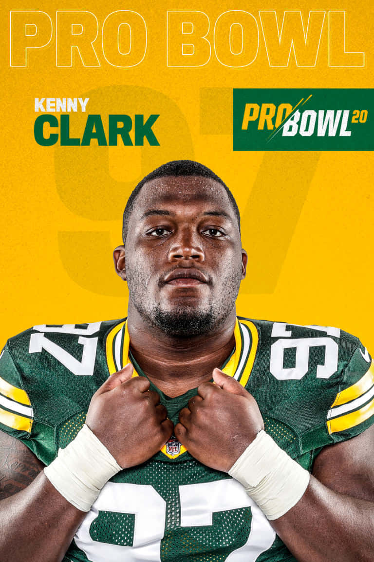 足球 桌布 壁紙 — 一位堅定的NFL球員身穿綠色和黃色球衣，在帶有'PRO BOWL'文字的醒目黃色背景前抓住衣領。