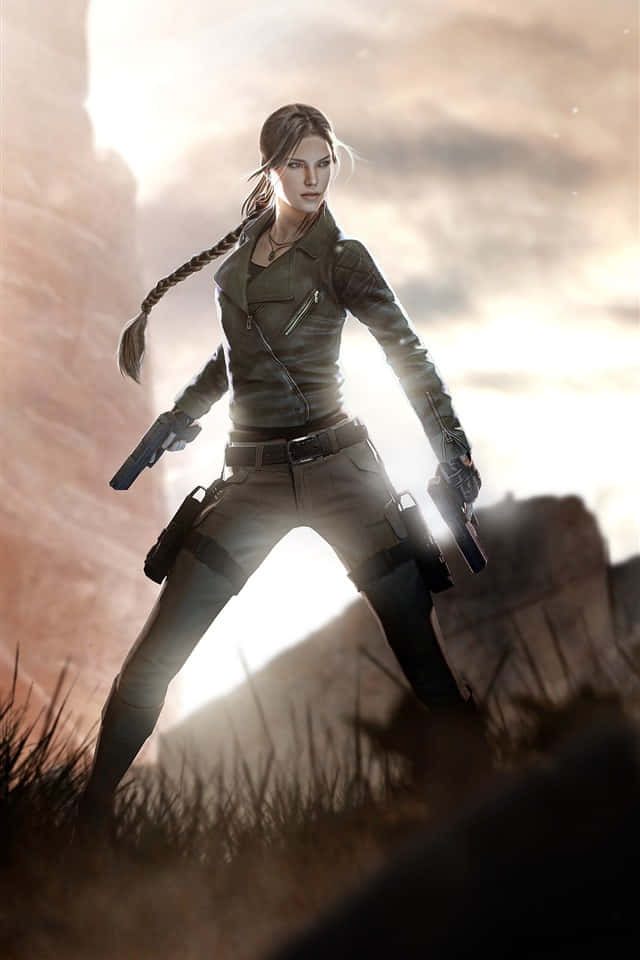 iPhone Xs Rise Of The Tomb Raider 桌布 壁紙 — 一位堅定的女性冒險家身穿皮革裝備，手持兩把手槍，站在戲劇性的沙漠峽谷背景下。