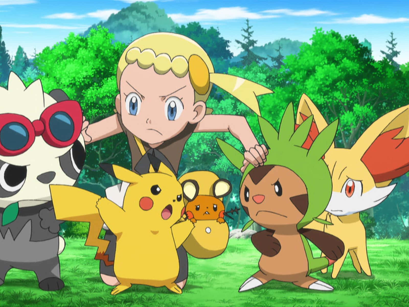 Pokemon Rivalries 桌布 壁紙 — 一位堅定的年輕訓練家與五隻色彩繽紛的寶可夢站在充滿活力的綠色森林空地上，頭頂是明亮的藍天。