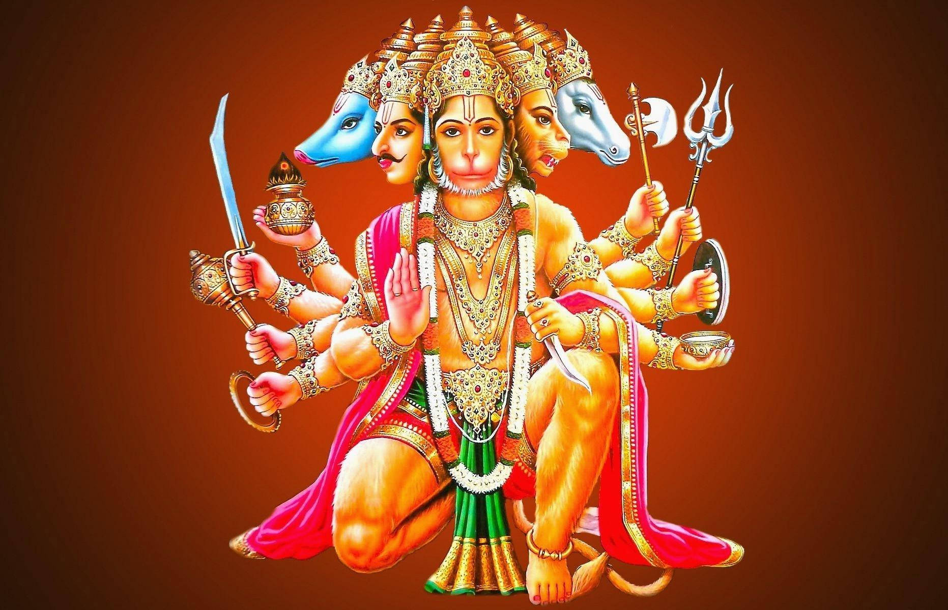lord hanuman HD 桌布 壁紙 — 一位多頭印度教神祇，擁有象頭和馬頭，飾以黃金珠寶和紅色衣物，在溫暖的棕色背景下手持神聖武器。