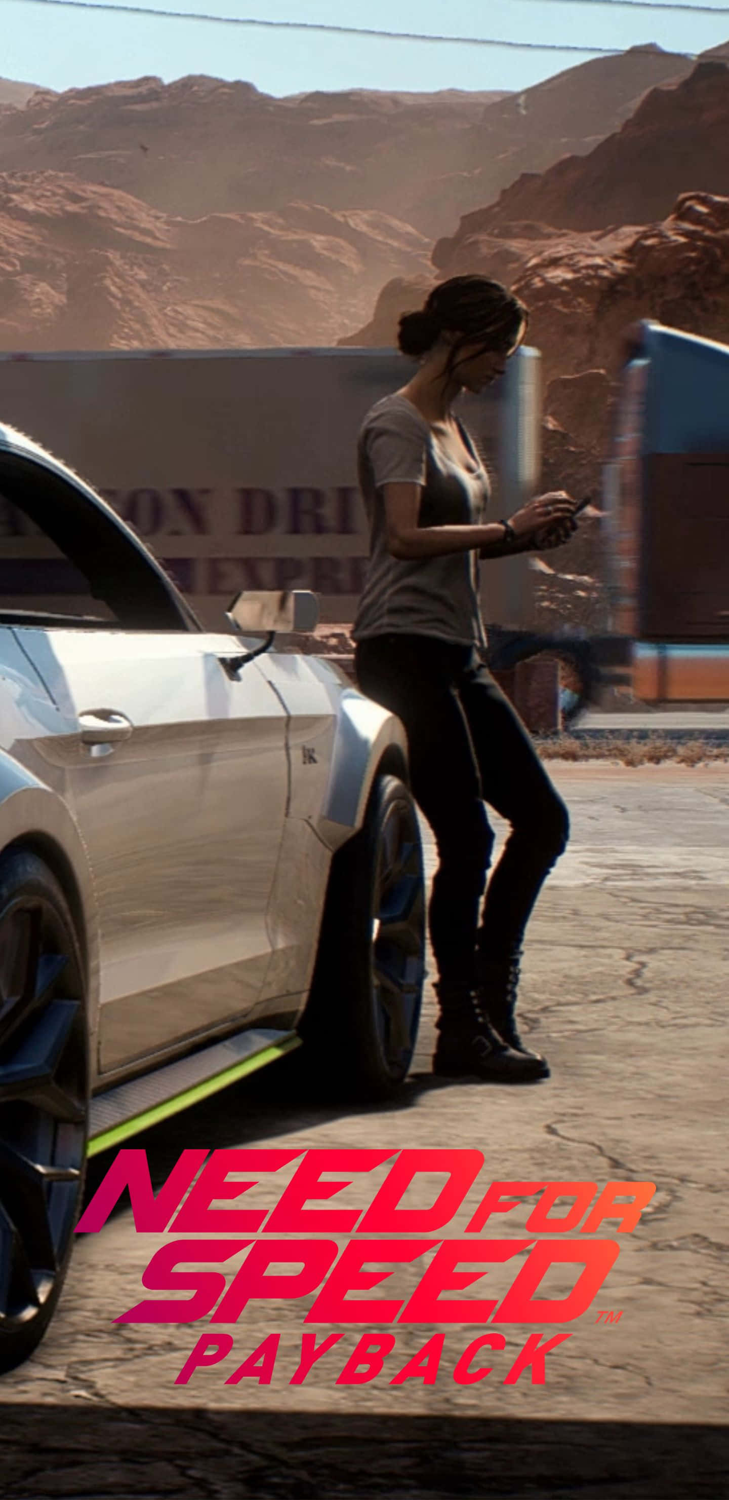 Pixel 3xl Need For Speed Payback 桌布 壁紙 — 一位女士靠在一輛流線型的銀色跑車上，身處陽光明媚的沙漠峽谷，周圍有岩石峭壁，身後有一輛行駛中的卡車。