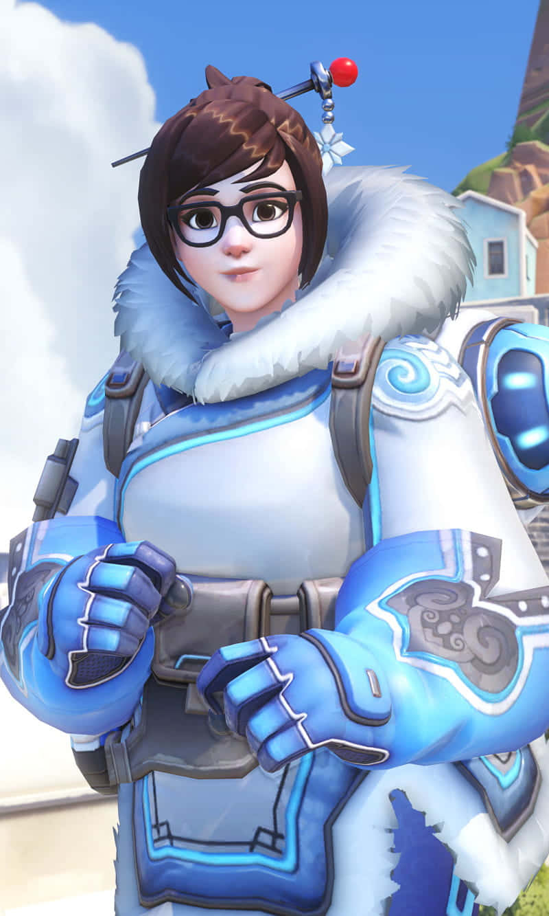 Overwatch 桌布 壁紙 — 一位女性電子遊戲角色穿著藍白色冬季服裝，配有毛領和眼鏡，站在明亮的天空下。