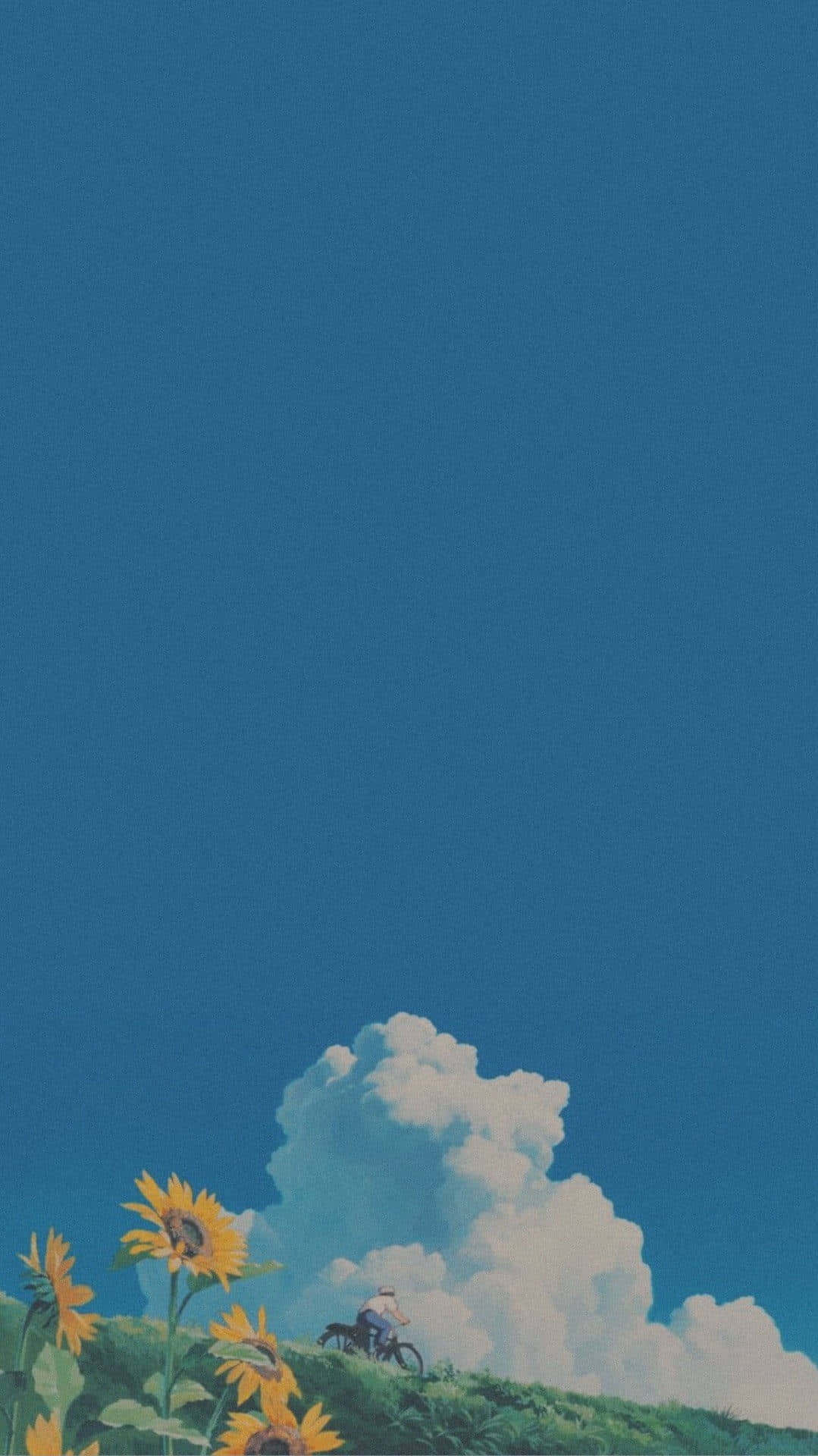 Aesthetic Ghibli 桌布 壁紙 — 一位孤獨的自行車騎士在廣闊藍天和蓬鬆白雲下，踩著自行車穿過向日葵騎上山坡。