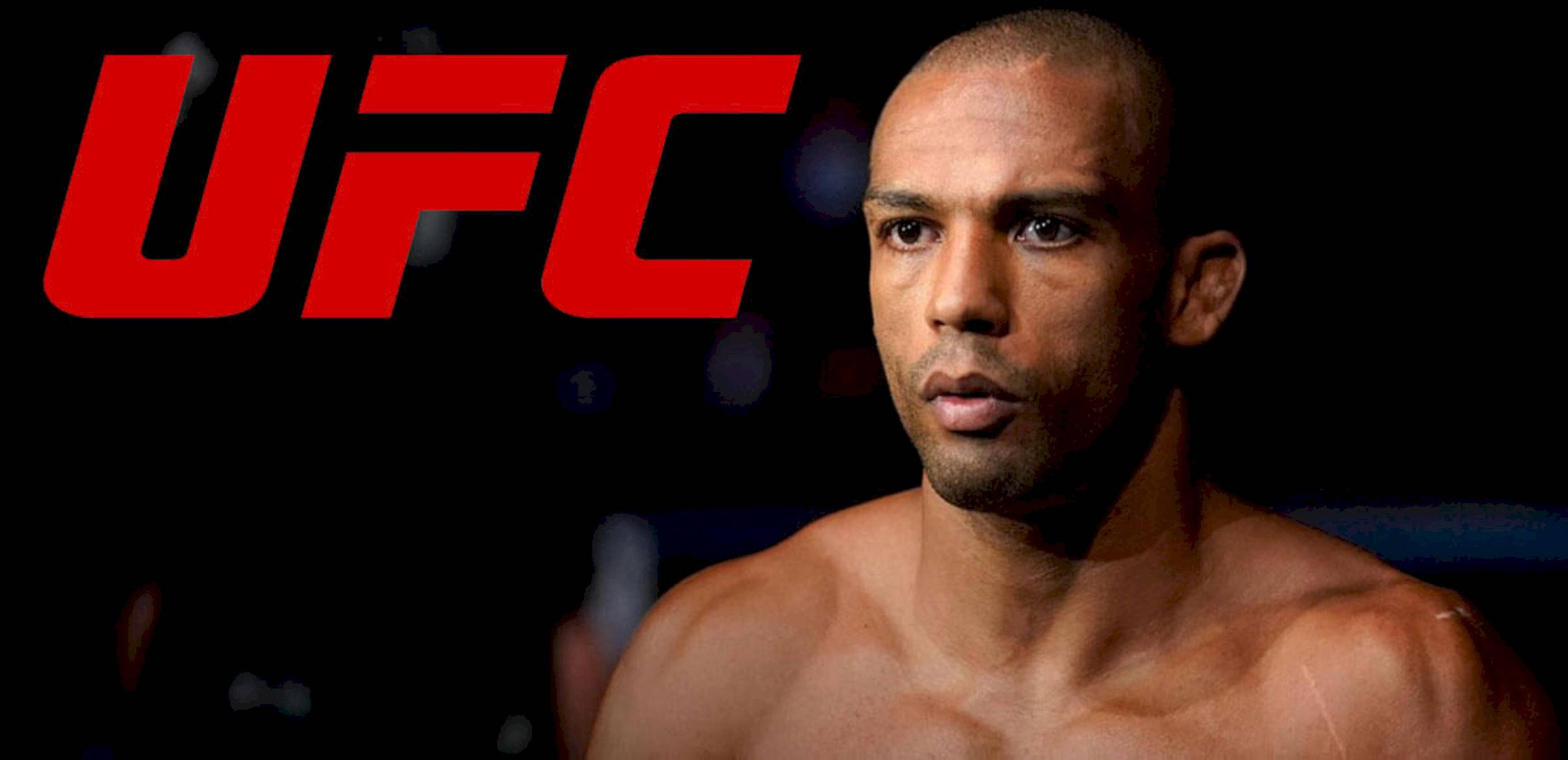 UFC 桌布 壁紙 — 一位專注的UFC拳手在黑暗背景下凝視，背後閃耀著大膽的紅色UFC標誌。
