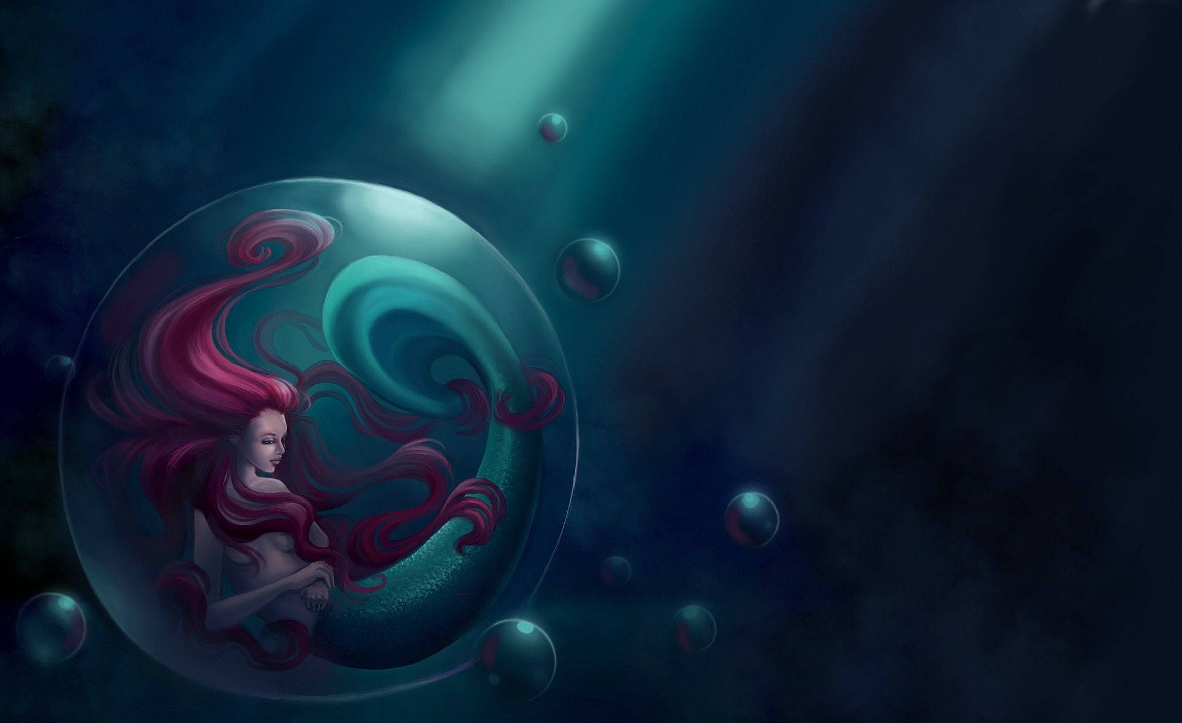 The Little Mermaid 桌布 壁紙 — 一位平靜的美人魚，擁有飄逸的紅髮，漂浮在一個發光的泡泡內，周圍環繞著較小的泡泡，背景是深海洋藍色。