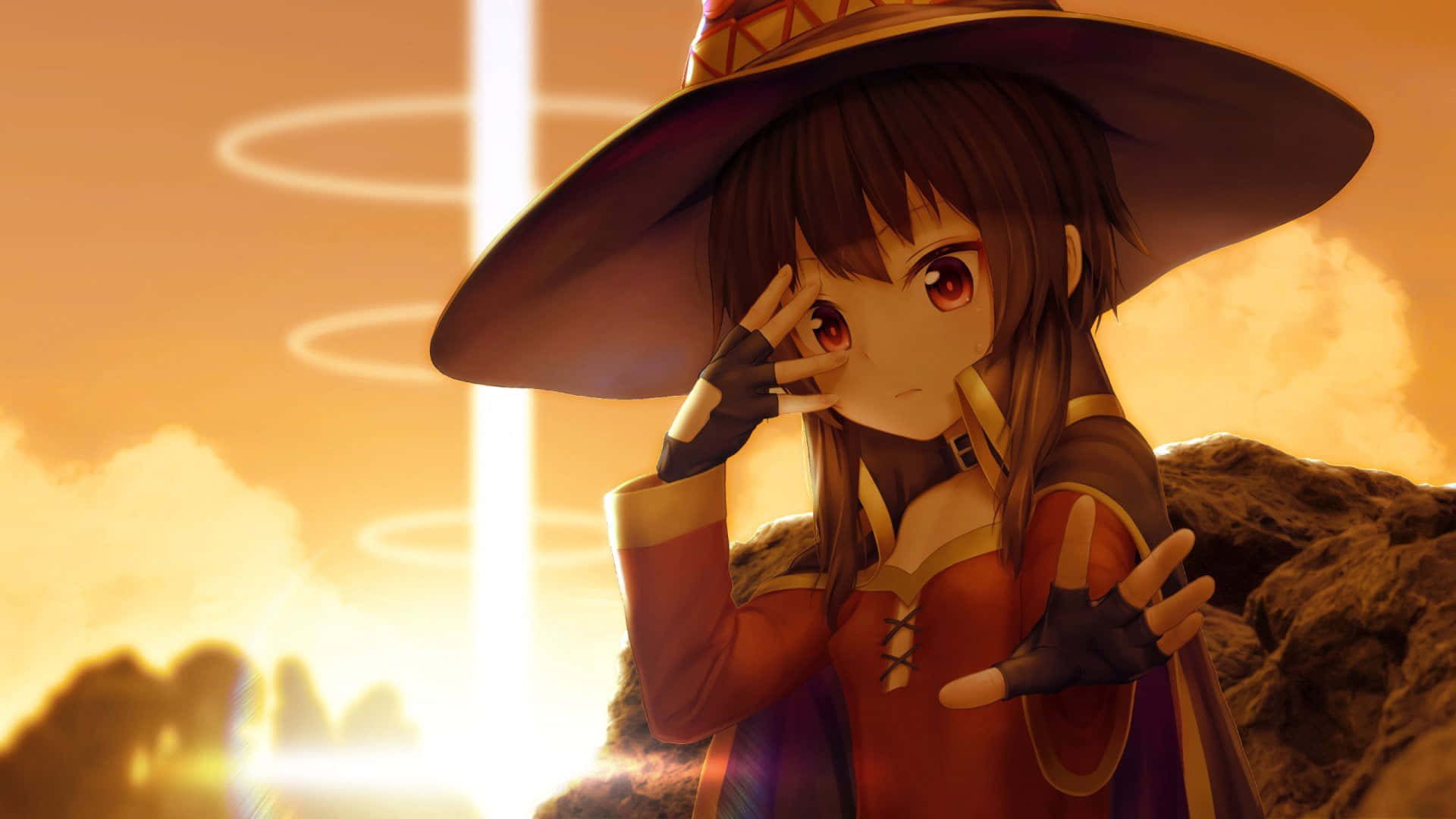Konosuba God's Blessing On This Wonderful World 桌布 壁紙 — 一位年輕的動漫女巫戴著寬邊帽站在岩石地形上，她的手靠近臉龐，發光的環圈在她身後圍繞著一道明亮的光束旋轉。