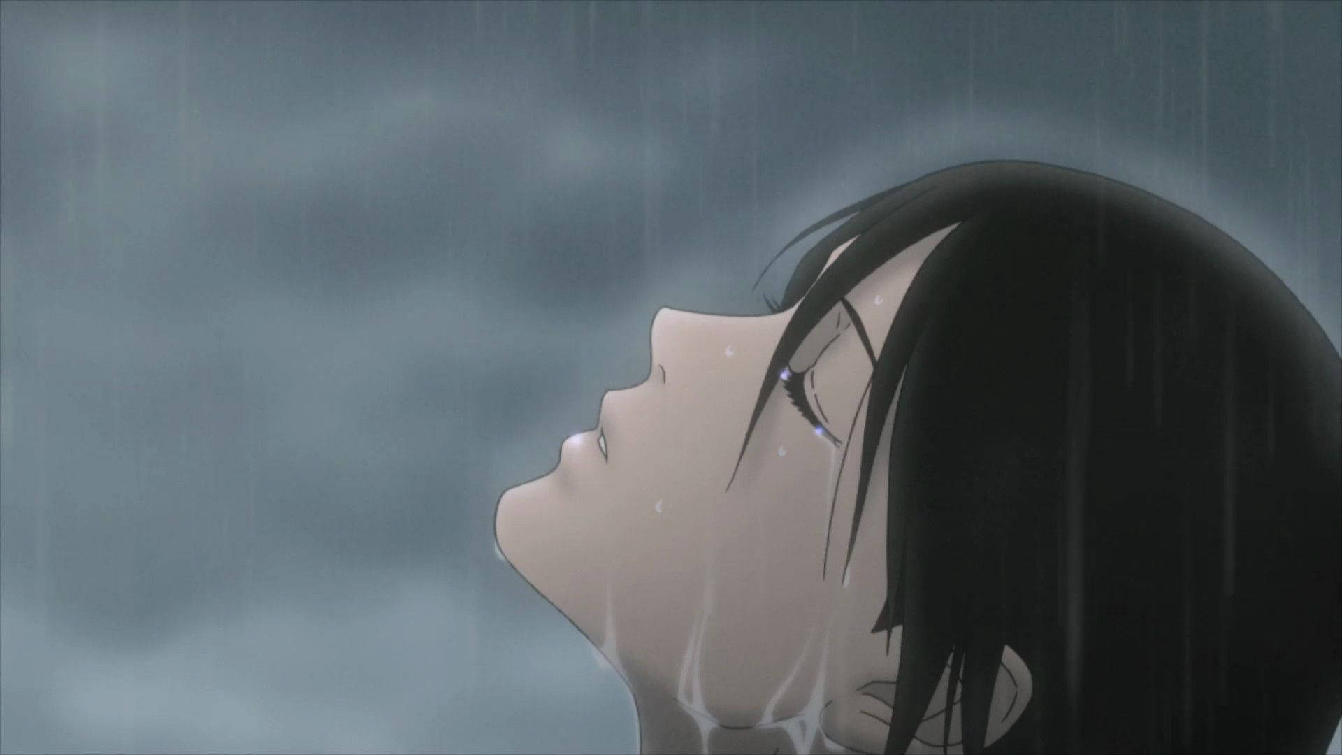 黑發動漫女孩在雨中仰望，臉上帶著淚水。 — 憂鬱動漫女孩 GIF 壁紙