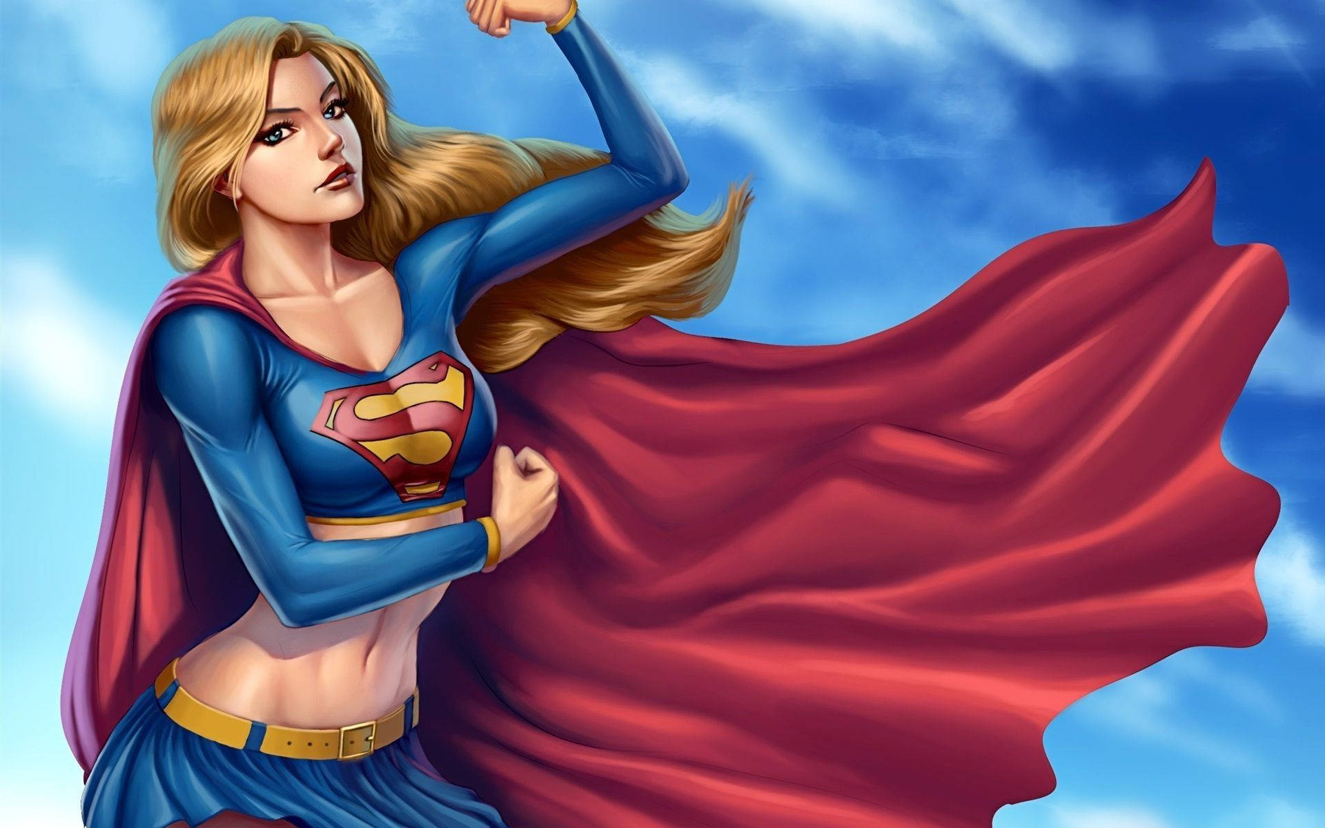 Superwoman 桌布 壁紙 — 一位強大的金髮女超級英雄穿著藍色和紅色的服裝，在明亮的藍天下彎曲手臂，披風飄揚。