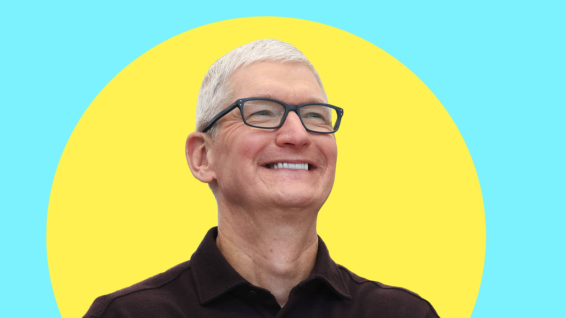 Leadership 桌布 壁紙 — 一位戴眼鏡、灰白頭髮的微笑男士，身穿深色襯衫，背景是青色上的亮黃色圓圈。