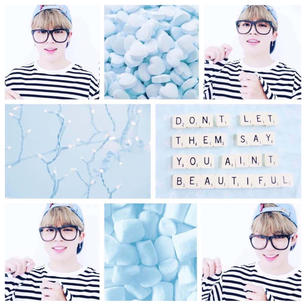 Jimin Aesthetic 桌布 壁紙 — 一位戴眼鏡、穿條紋襯衫的年輕男子在心形棉花糖和寫著「don't let them say you ain't beautiful」的字板旁微笑。
