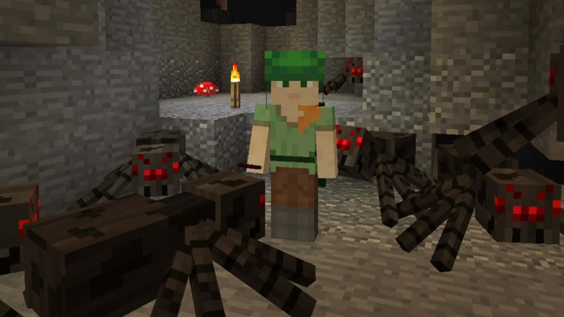 Minecraft Spider 桌布 壁紙 — 一位戴著綠色帽子的Minecraft玩家被敵對蜘蛛包圍，在一個由火炬照亮的昏暗地下洞穴中。