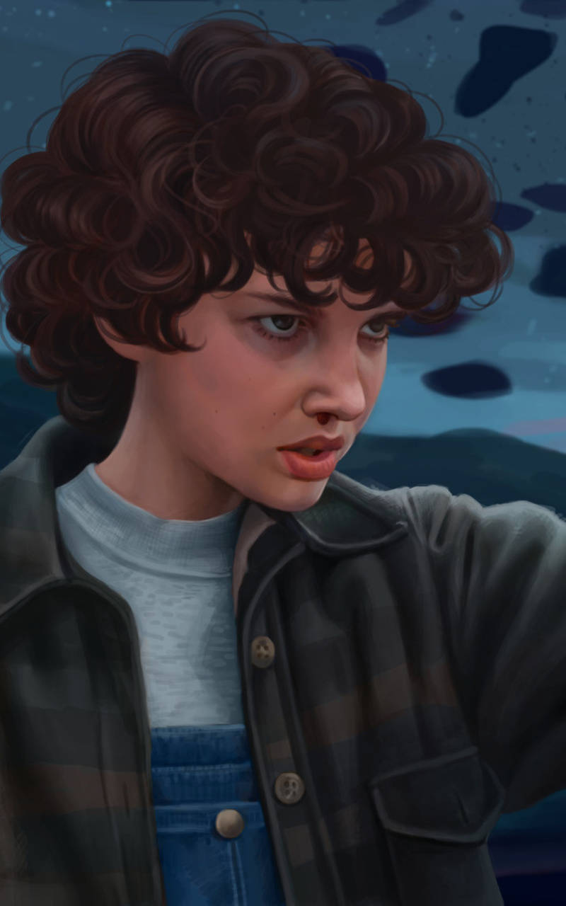 Aesthetic Stranger Things Eleven 桌布 壁紙 — 一位擁有棕色捲髮的年輕人，在繁星點點的暮色天空下，穿著格子外套搭配牛仔吊帶褲。