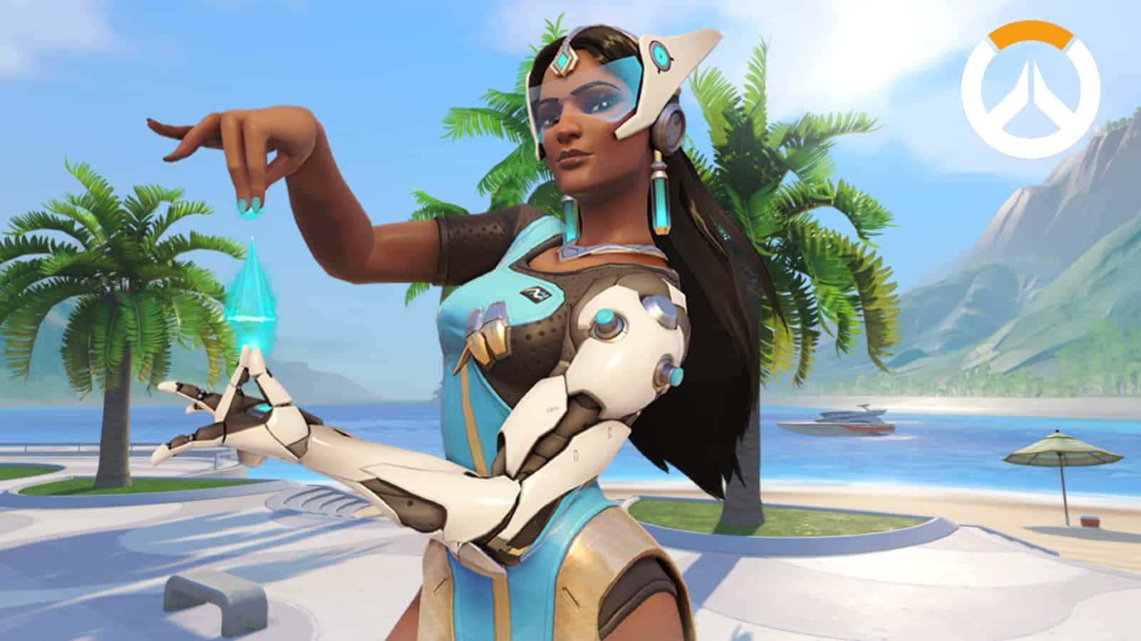 Overwatch Symmetra 桌布 壁紙 — 一位擁有機械臂的未來戰士在熱帶海灘上操控發光的藍色能量，背景有棕櫚樹和山脈。