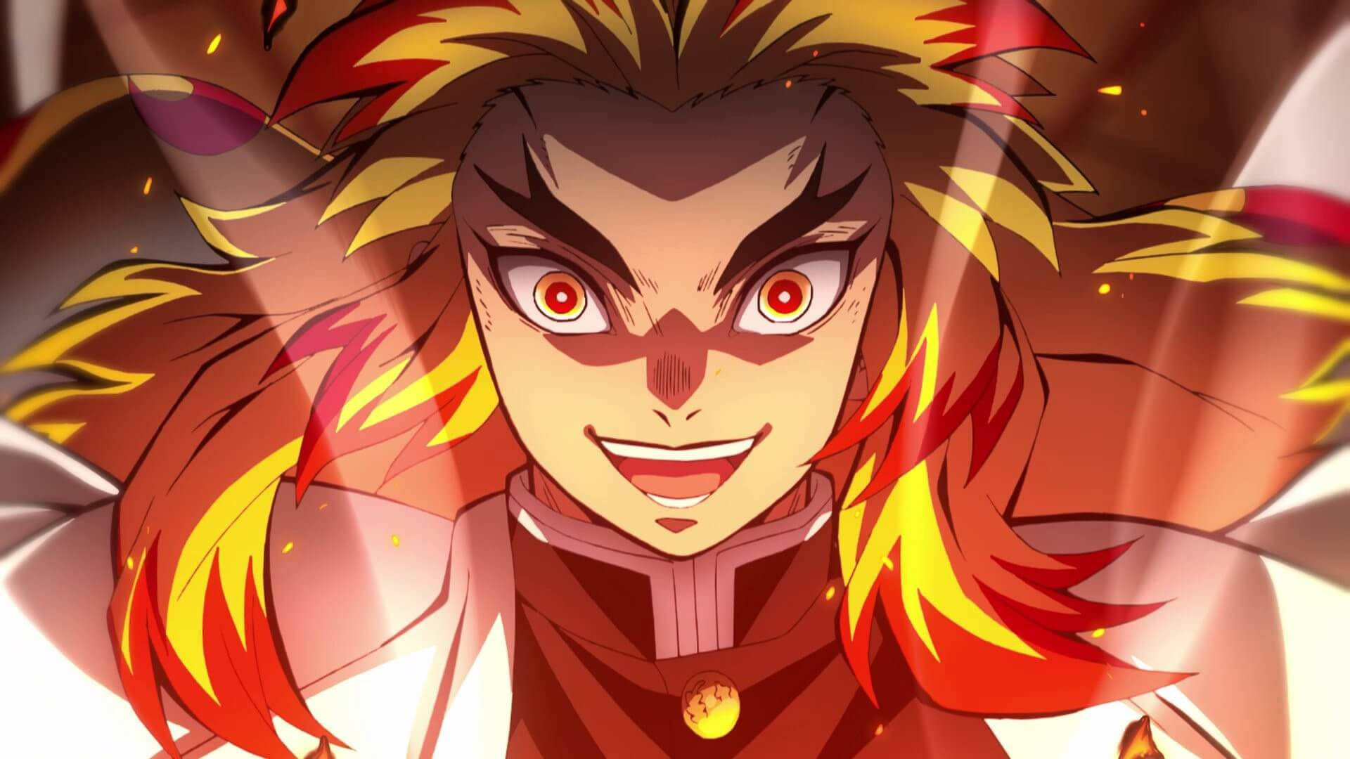 Demon Slayer Season 2 桌布 壁紙 — 一位擁有火焰般頭髮的動漫戰士，閃爍著紅色眼睛和兇猛的笑容，在溫暖發光的背景下散發出強烈的能量。