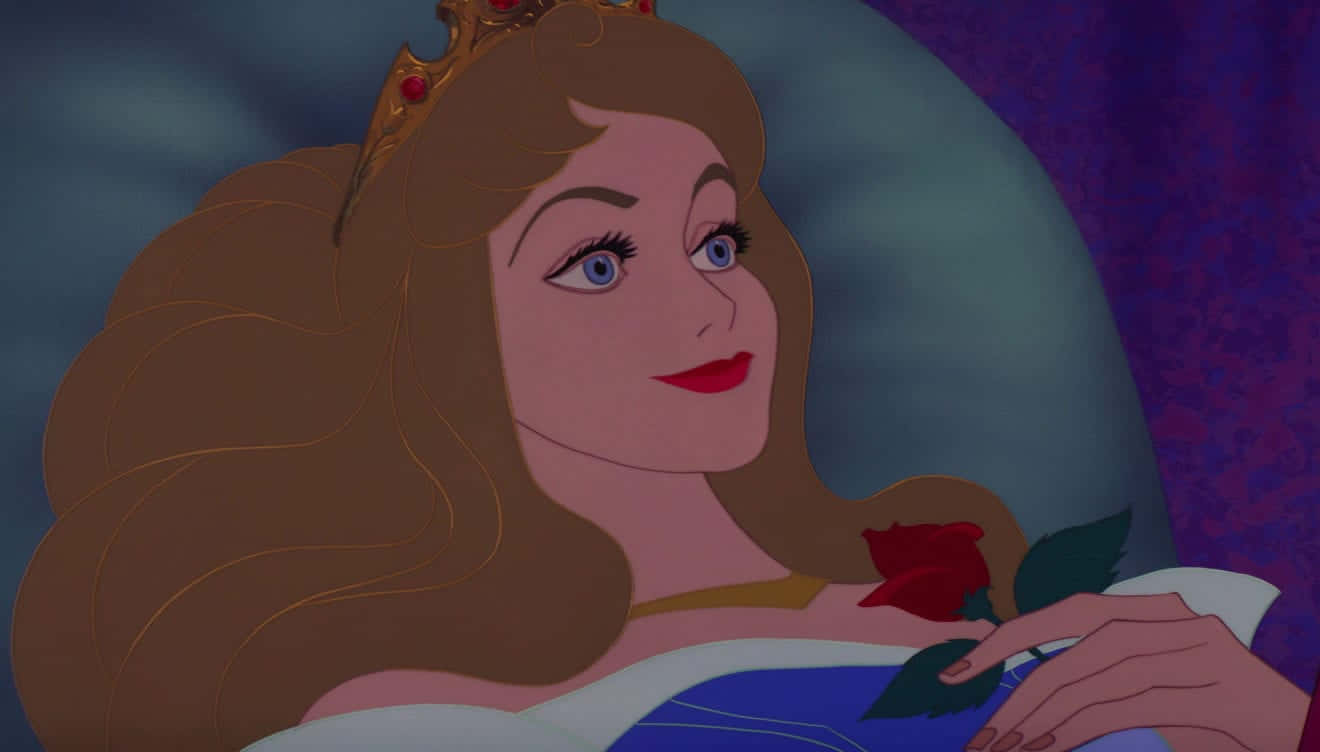 sleeping beauty 桌布 壁紙 — 一位擁有長長棕色頭髮和藍色眼睛的公主，戴著金色王冠，輕輕地拿著一朵紅玫瑰。