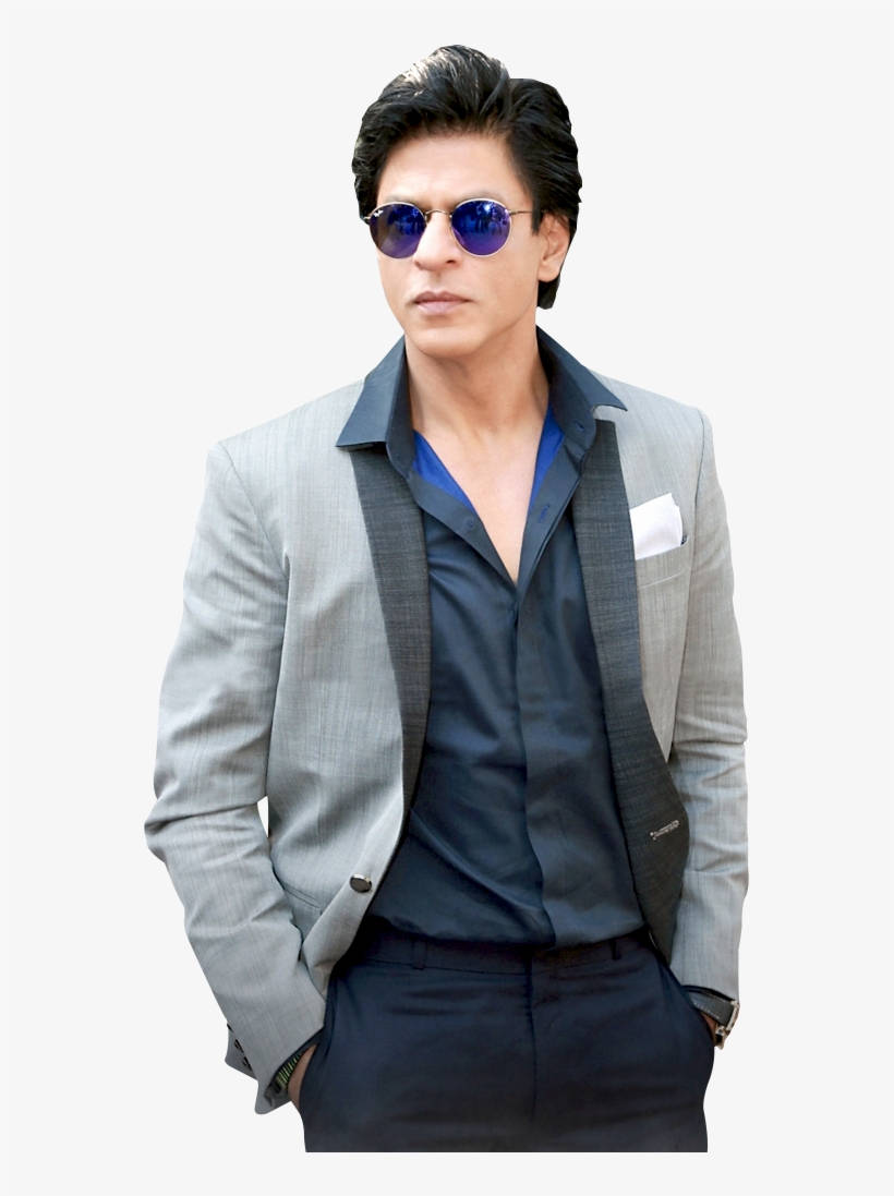 Shahrukh 桌布 壁紙 — 一位時尚男士身穿灰色西裝外套和藍色襯衫，雙手插袋，戴著反光太陽眼鏡，自信地擺姿勢。