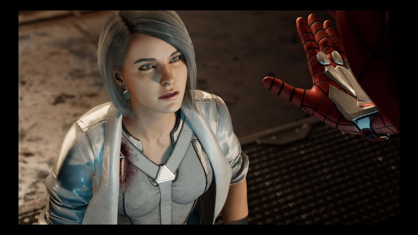 Silver Sable 桌布 壁紙 — 一位灰髮女士穿著銀色外套，抬頭看著一隻向她伸出的紅藍蜘蛛主題手套。