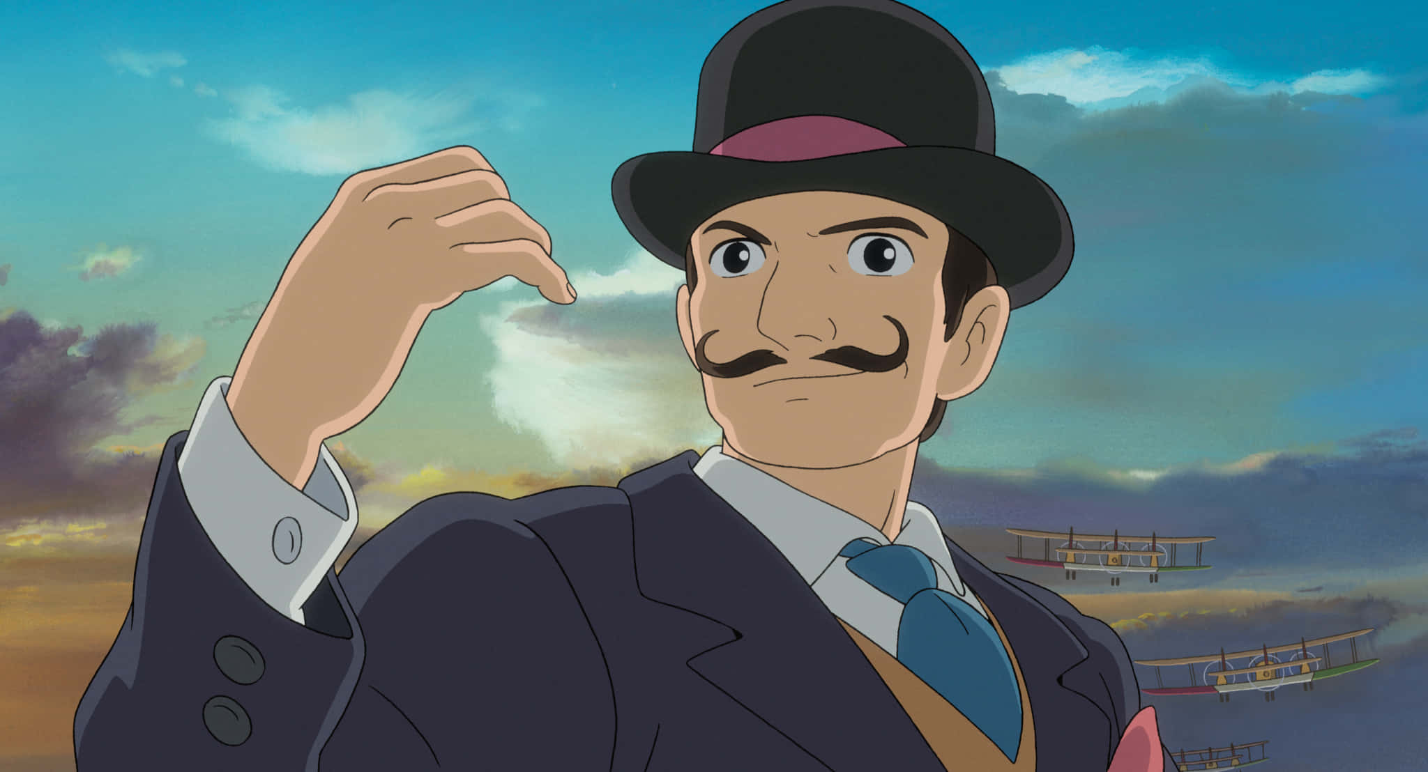 The Wind Rises 桌布 壁紙 — 一位留鬍子的紳士，戴著高頂帽、穿著西裝，在暮色天空下自信地做手勢，身後有復古雙翼機飛過。