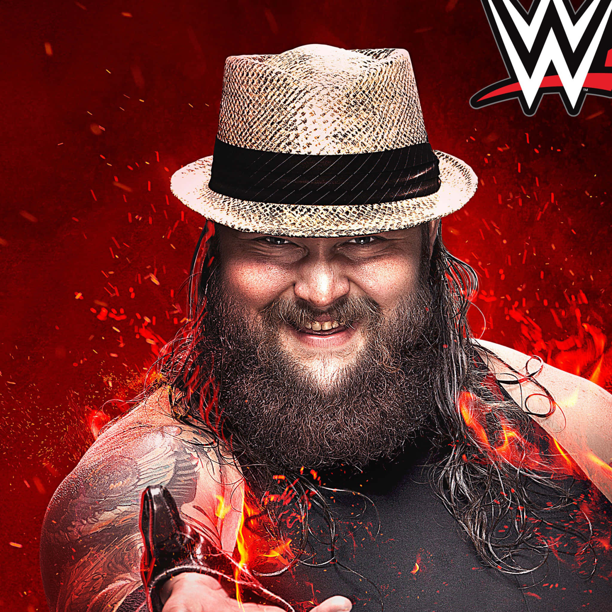WWE 桌布 壁紙 — 一位留鬍鬚、戴草帽的摔角手在帶有WWE標誌的火紅背景上兇狠地咧嘴笑。