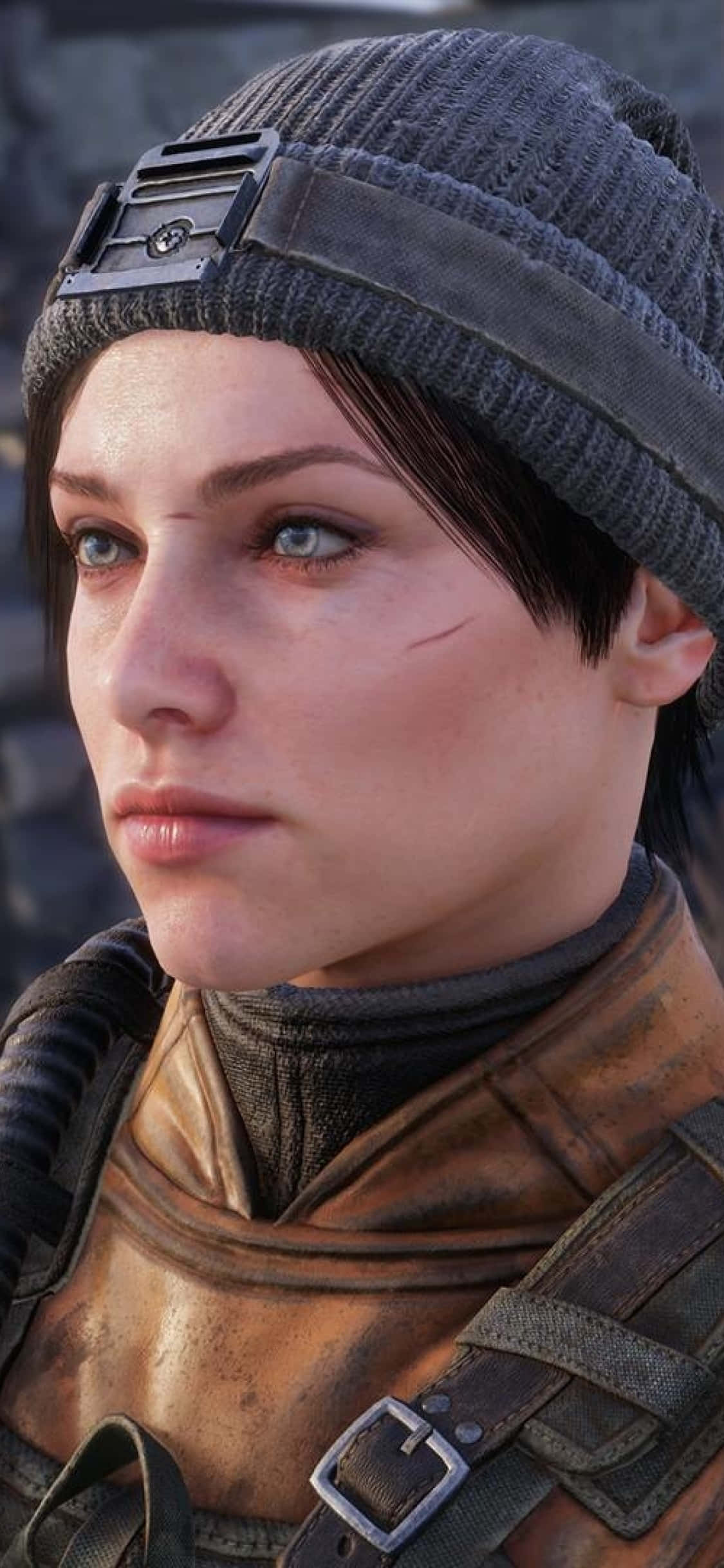 iPhone X Metro Exodus 桌布 壁紙 — 一位短黑髮、戴灰色毛帽、身穿堅固棕色皮甲、神情堅定的女兵特寫。