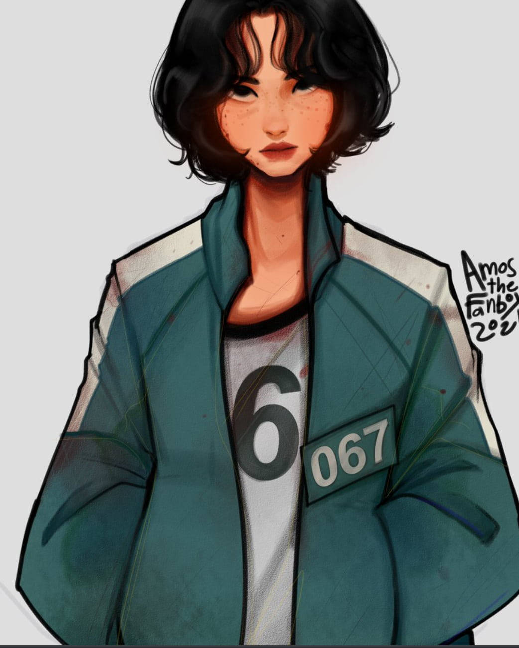 game 桌布 壁紙 — 一位短黑髮的年輕女性身穿青綠色監獄風格外套，內搭白色襯衫，襯衫上有數字六和補丁067。