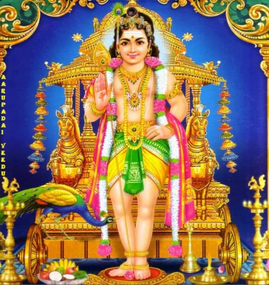 Hindu God 桌布 壁紙 — 一位神聖年輕的神祇，佩戴金飾和彩色花環，威嚴地坐在裝飾華麗的金色戰車上，伴有孔雀和供品。
