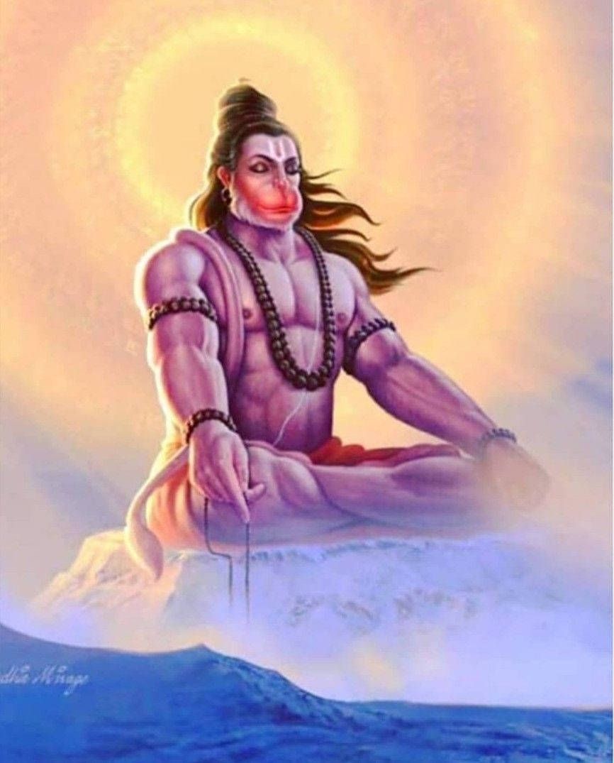 hanuman ji HD 桌布 壁紙 — 一位神聖的猴神在雪峰上靜坐冥想，身後散發出燦爛的金色光環。