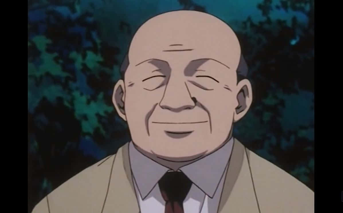 Hunter X Hunter Zebro 桌布 壁紙 — 一位穿著米色西裝的年長光頭動畫男子，在深藍綠色葉子背景前溫暖地微笑。