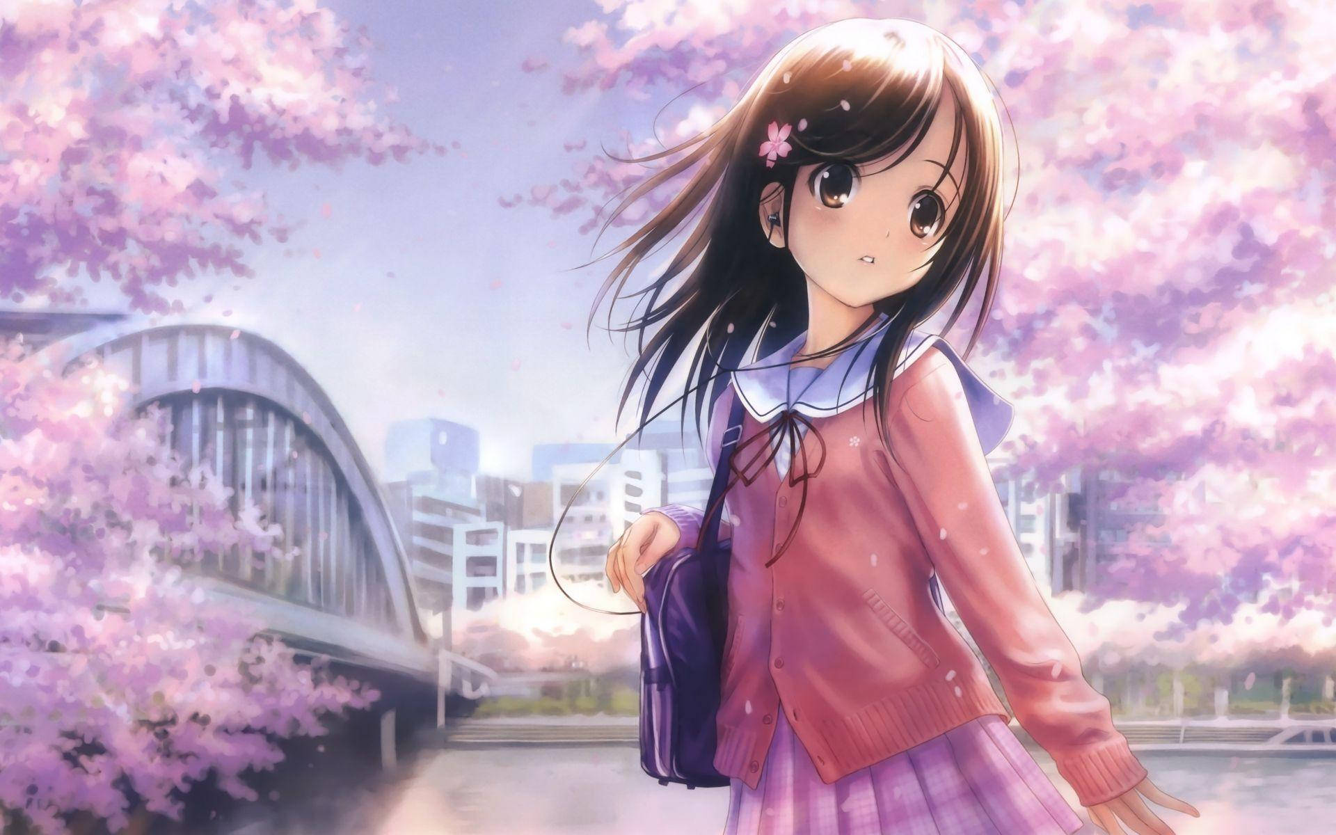 Girly Cartoon 桌布 壁紙 — 一位穿著粉紅色校服的年輕動漫女孩站在盛開的櫻花下，背景是一座現代橋樑。
