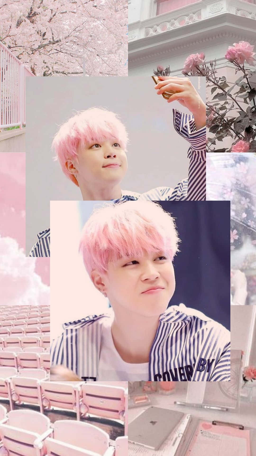 Jimin Aesthetic 桌布 壁紙 — 一位粉紅色頭髮的人在一個夢幻的拼貼畫中溫柔地微笑，拼貼畫包含櫻花、玫瑰和空的劇院座位，沐浴在柔和的粉紅色燈光下。