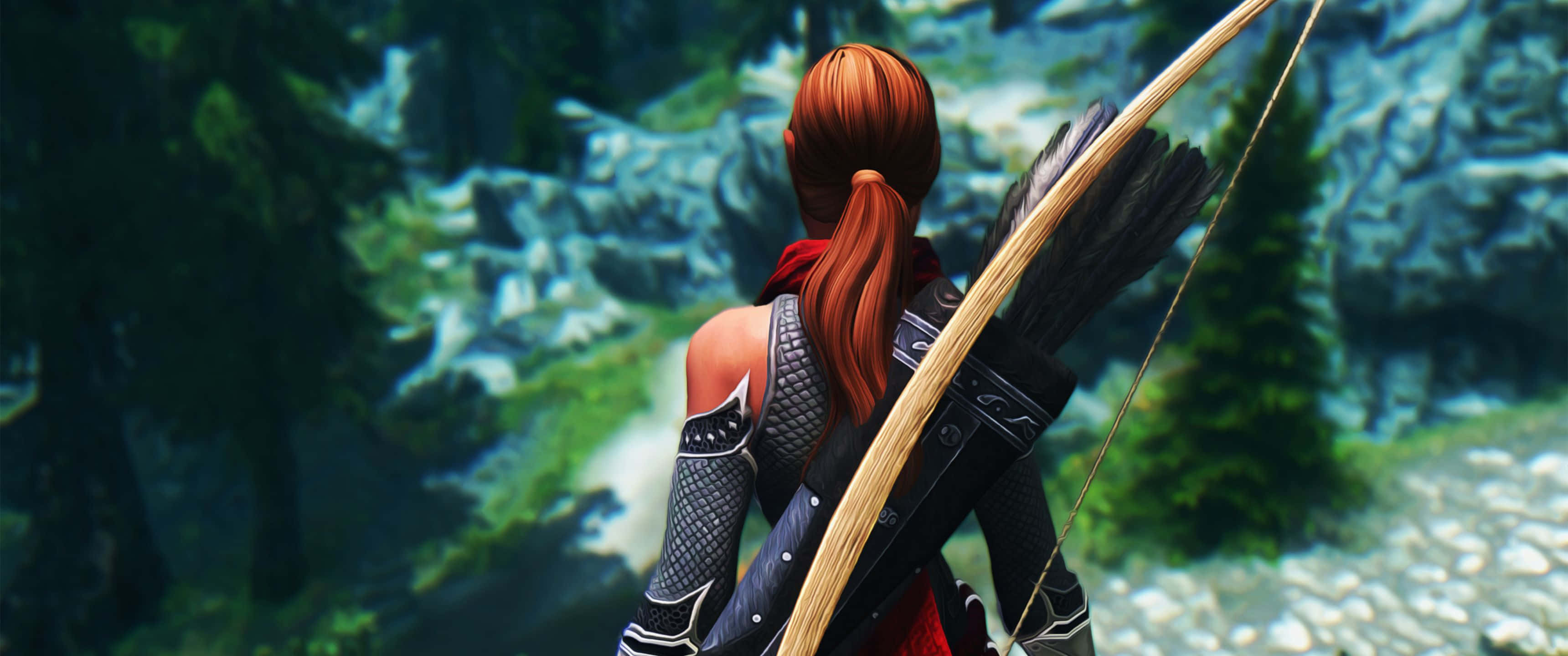3440x1440p The Elder Scrolls V Skyrim 桌布 壁紙 — 一位紅髮弓箭手身穿盔甲，站在樹木繁茂的懸崖上，手持弓箭，俯瞰岩石山谷。
