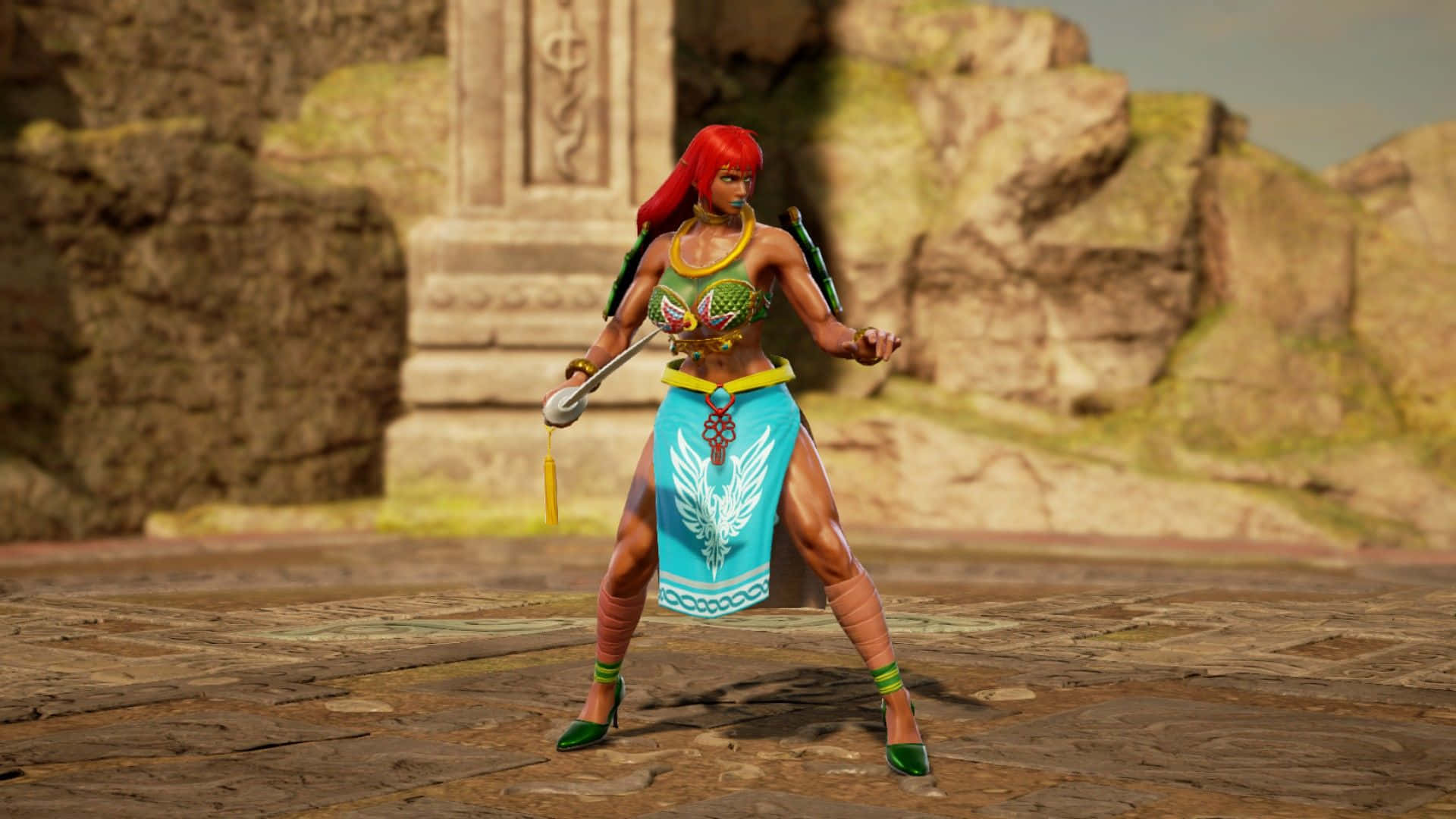 The Legend Of Zelda Urbosa 桌布 壁紙 — 一位紅髮戰士身穿綠色和藍色的部落服裝，在陽光照耀的古代廢墟中手持法杖站立。