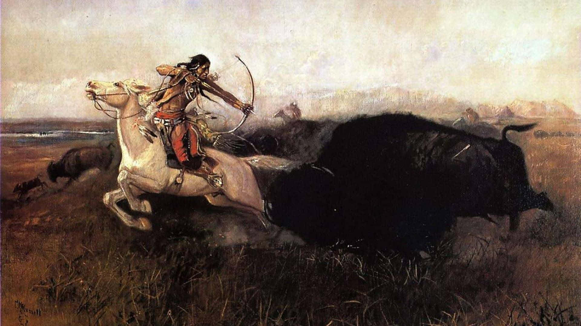 American Indian 桌布 壁紙 — 一位美洲原住民獵人騎著一匹揚起前蹄的白馬，拉弓射向一片廣闊草原上正在衝鋒的黑色野牛。