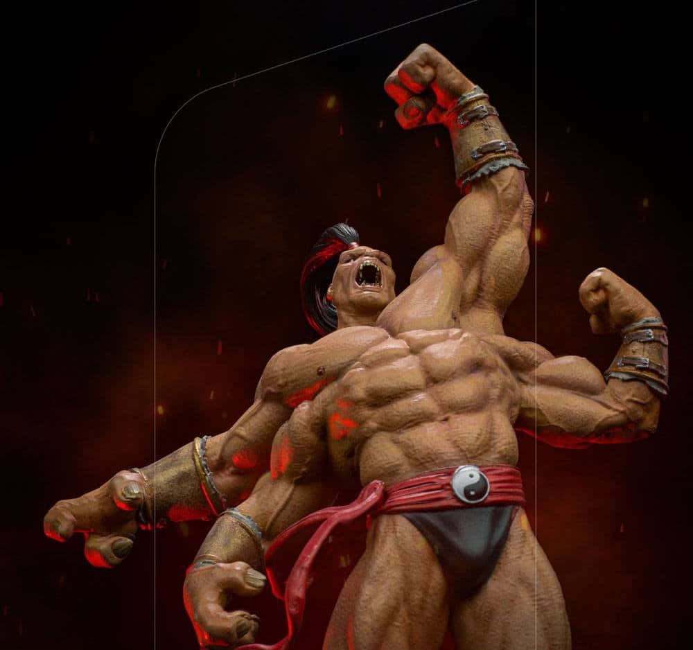 Mortal Kombat Goro 桌布 壁紙 — 一位肌肉發達的戰士在黑暗火熱的背景中舉起拳頭咆哮。