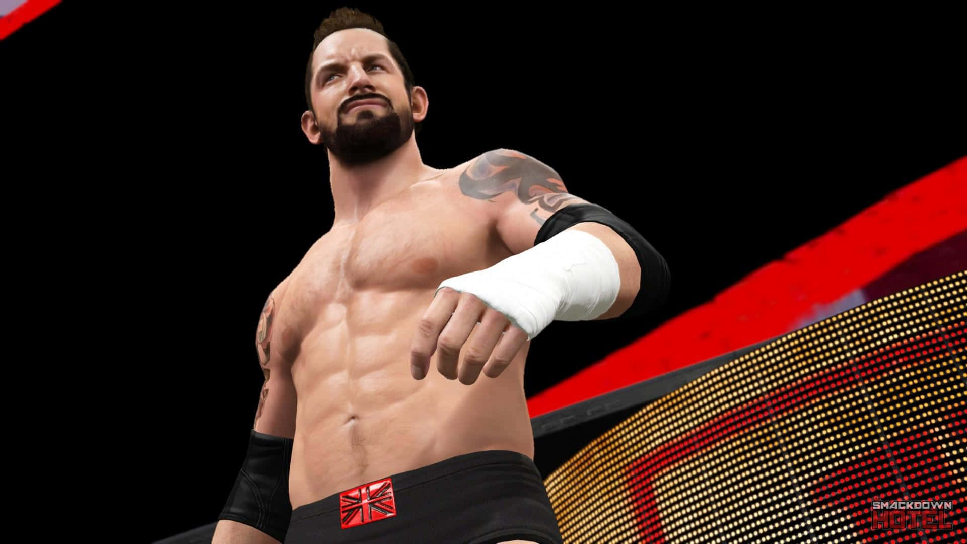 WWE 桌布 壁紙 — 一位肌肉發達的摔角手，身上有刺青，戴著白色護腕，自信地站在紅黑燈光下的摔角擂台上。