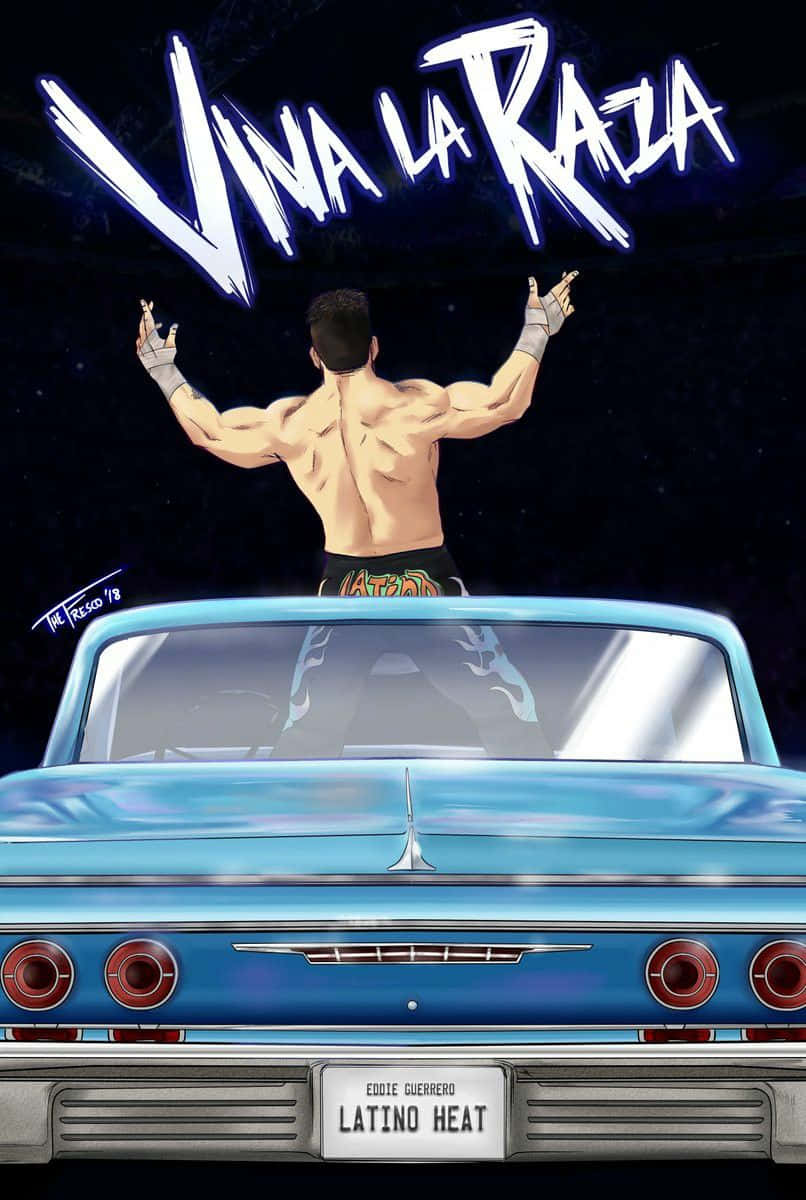 Wrestling 桌布 壁紙 — 一位肌肉發達的摔角手站在一輛復古藍色汽車上，在星光熠熠的夜空下高舉雙臂，上方有發光的「VIVA LA RAZA」字樣。