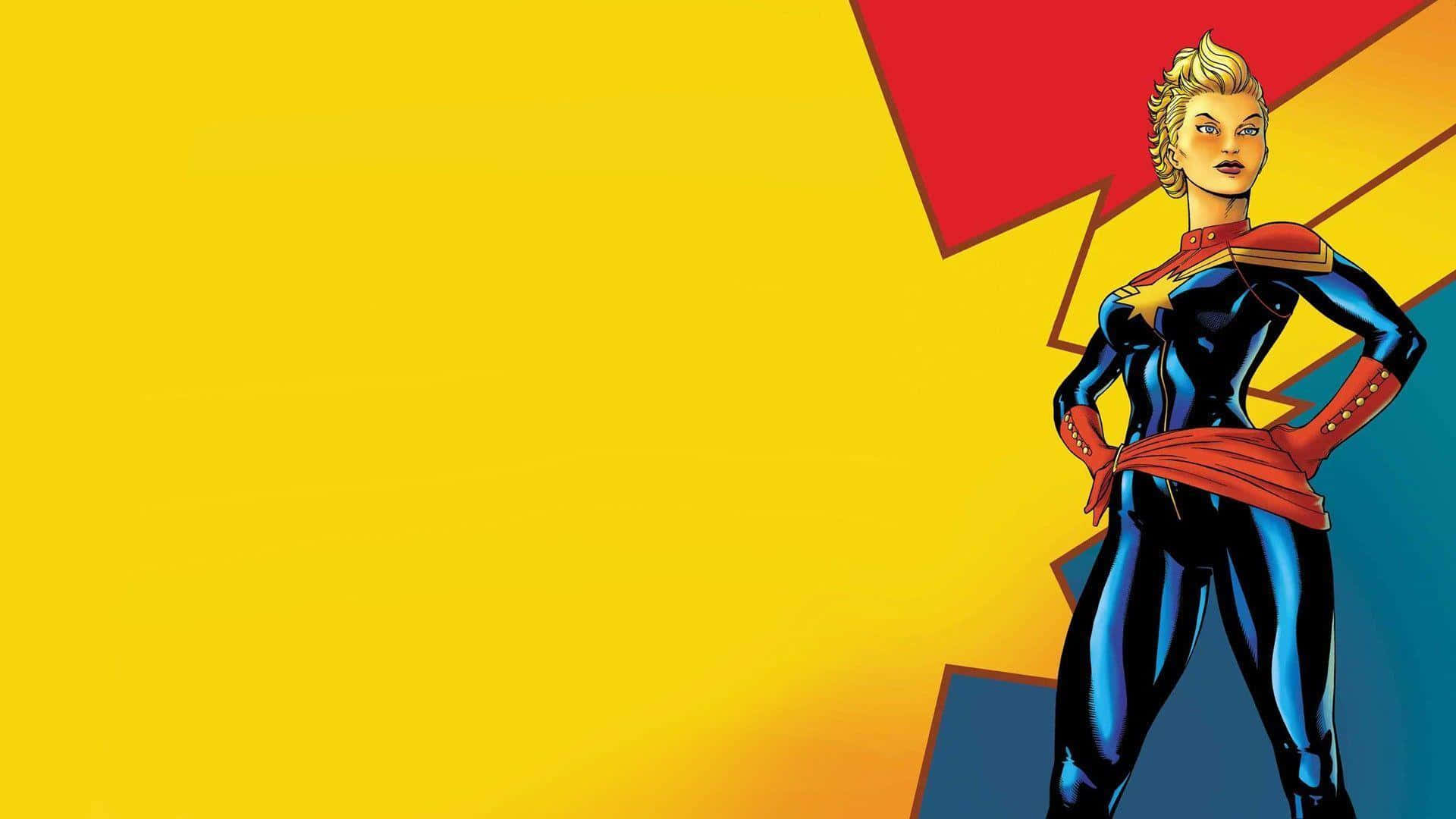 Captain Marvel HD 桌布 壁紙 — 一位自信的女性超級英雄，身穿帶有紅色點綴和星星標誌的藍色套裝，站在大膽的黃色和紅色幾何背景前。