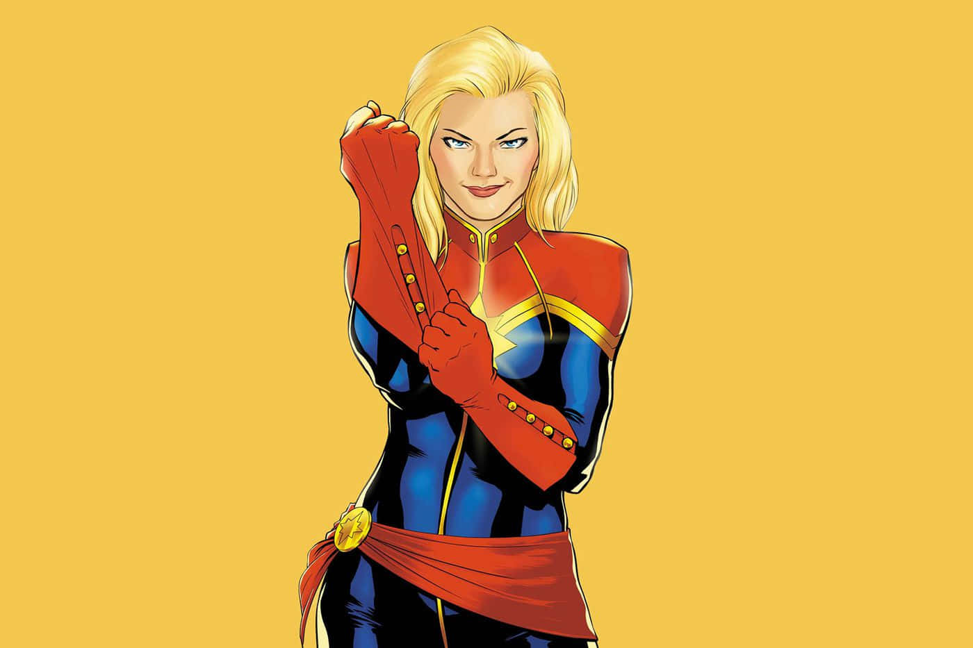 Captain Marvel Comic 桌布 壁紙 — 一位自信的女超級英雄穿著紅、藍、金色套裝，在純黃色背景前握拳擺姿勢。